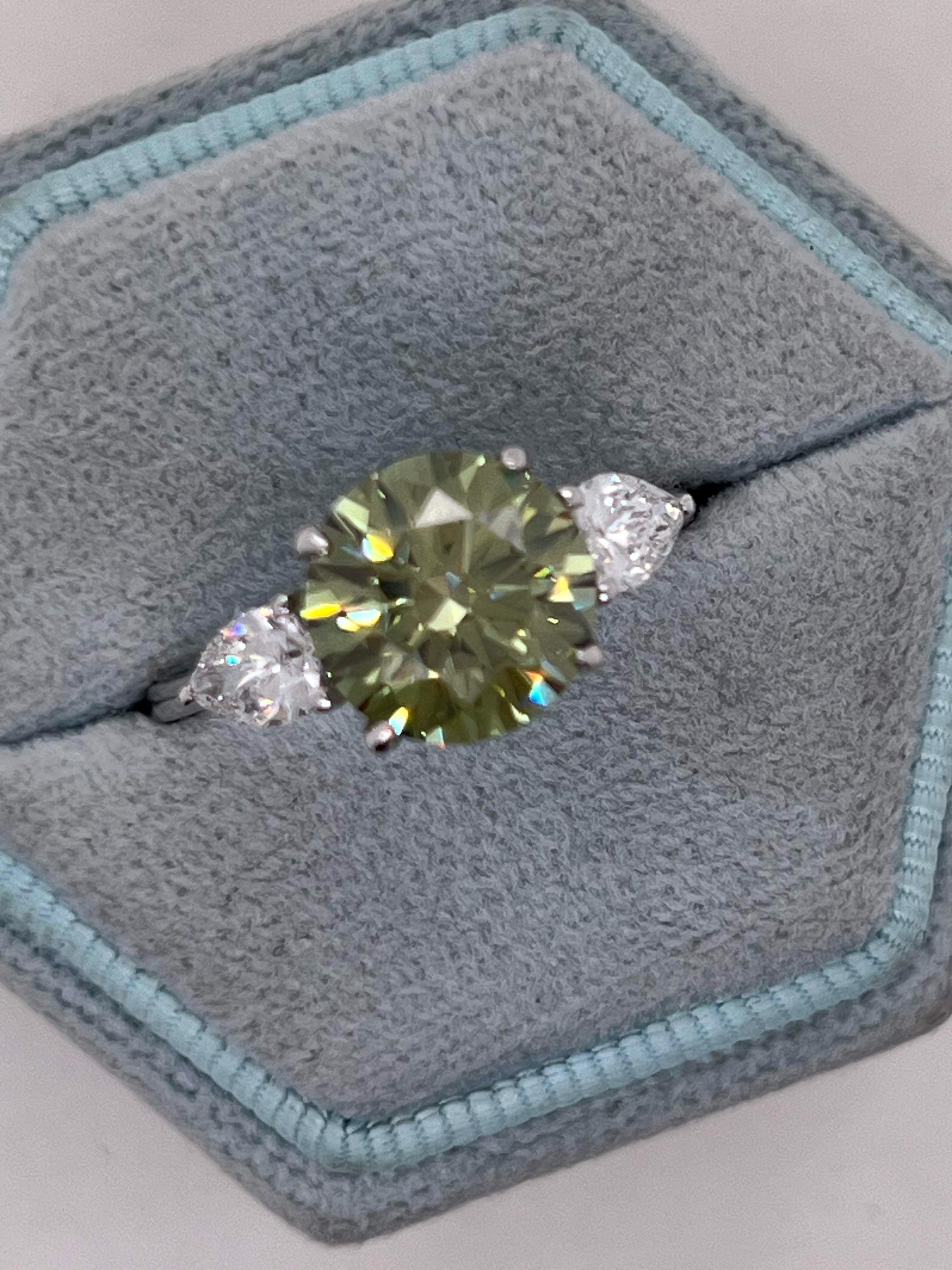 3.5 Carat Fancy Vivid Green VVS1 Clarity Round Cut Diamond Three Stone Engagement Ring Side Pears