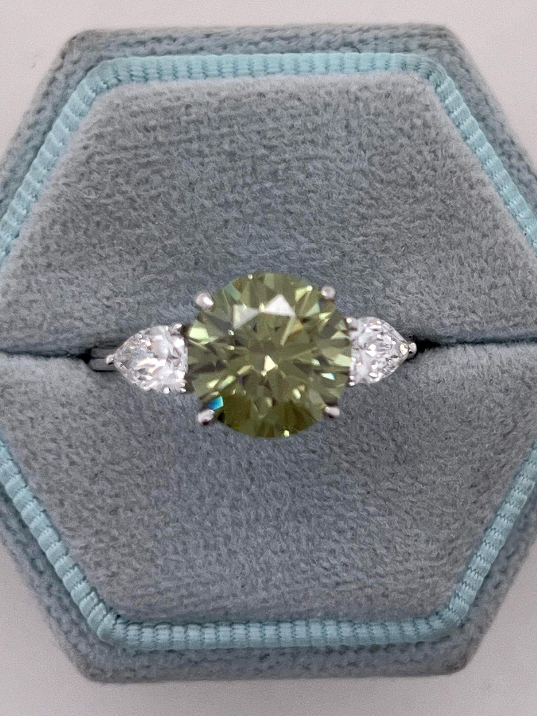 3.5 Carat Fancy Vivid Green VVS1 Clarity Round Cut Diamond Three Stone Engagement Ring Side Pears