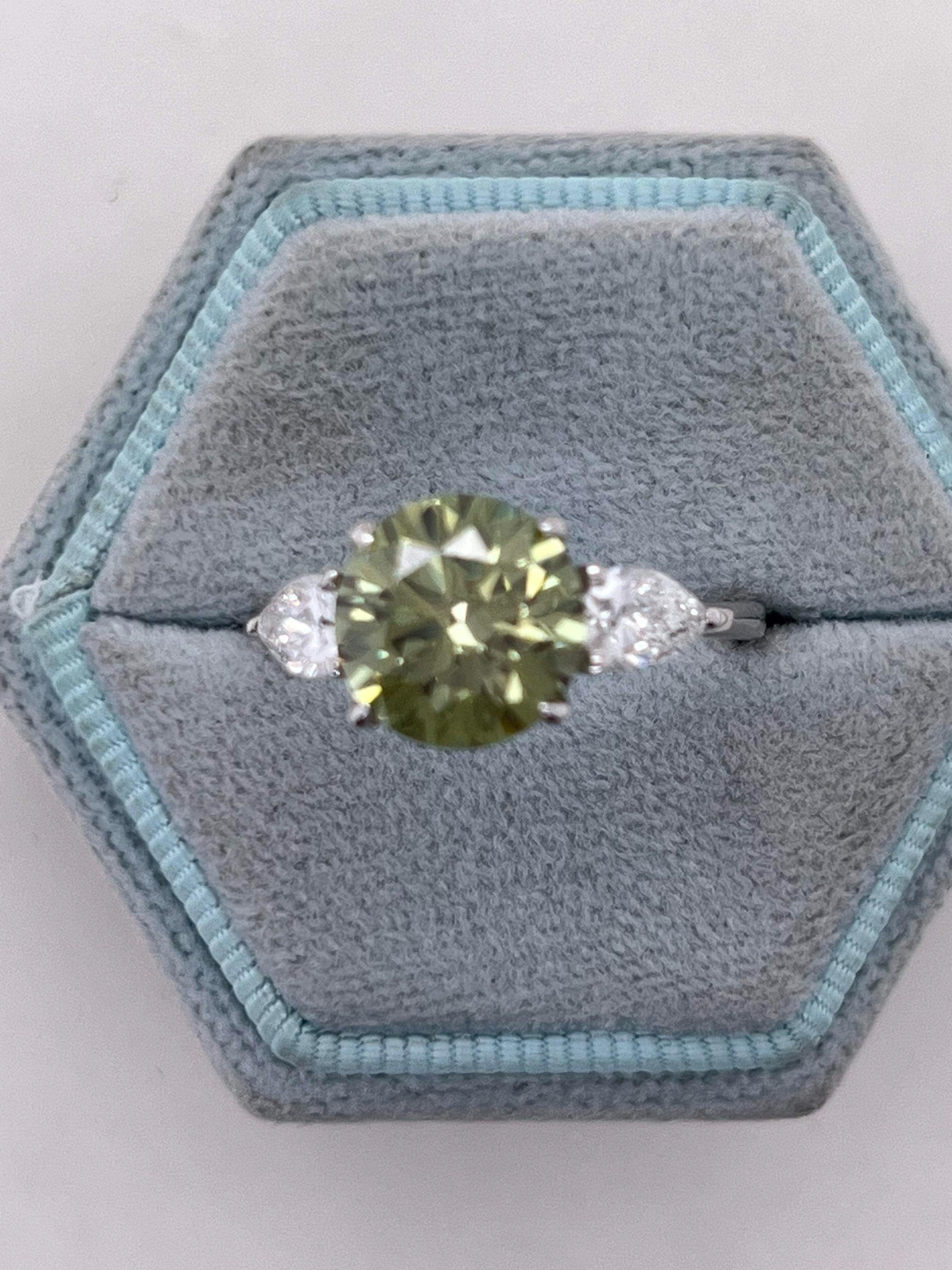3.5 Carat Fancy Vivid Green VVS1 Clarity Round Cut Diamond Three Stone Engagement Ring Side Pears
