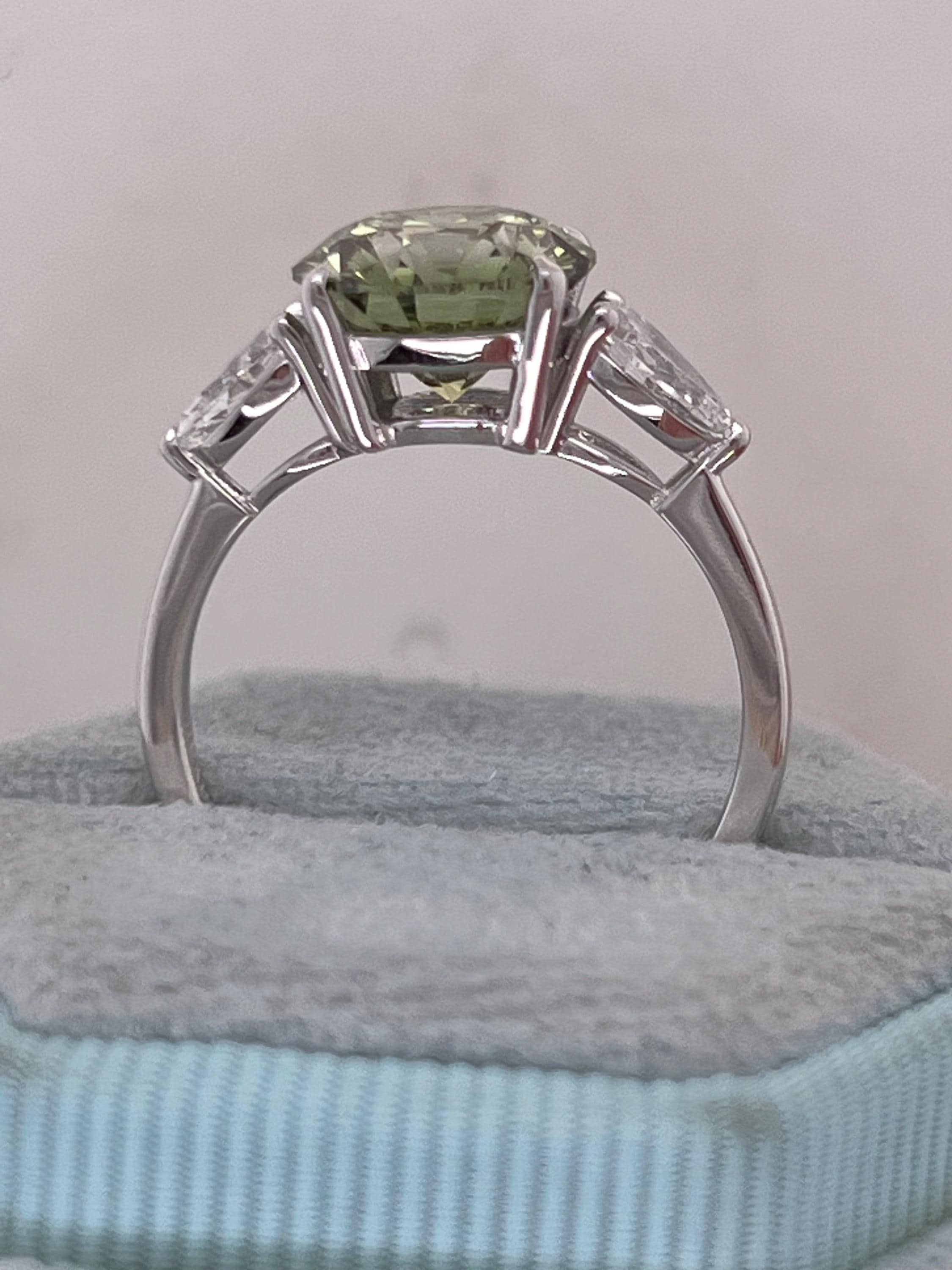 3.5 Carat Fancy Vivid Green VVS1 Clarity Round Cut Diamond Three Stone Engagement Ring Side Pears
