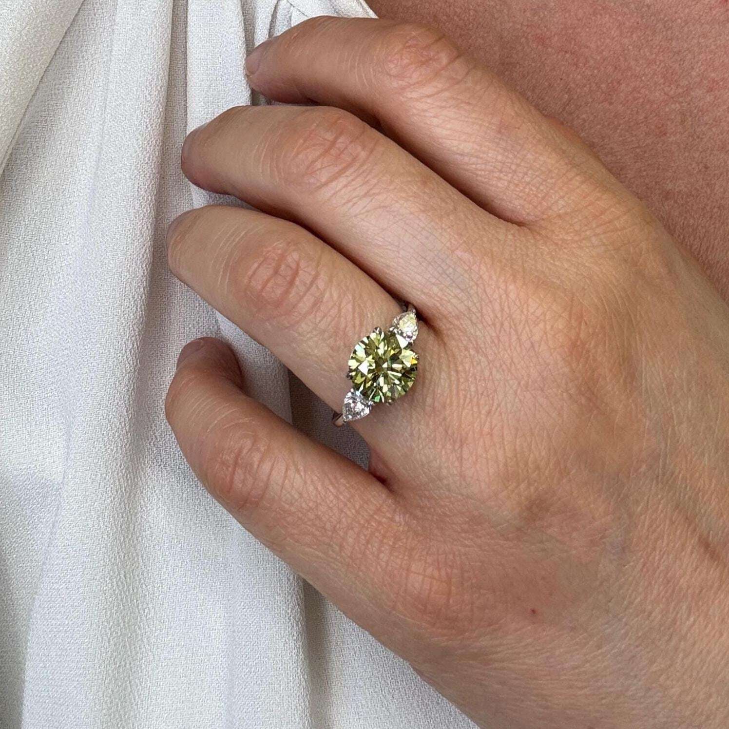 3.5 Carat Fancy Vivid Green VVS1 Clarity Round Cut Diamond Three Stone Engagement Ring Side Pears