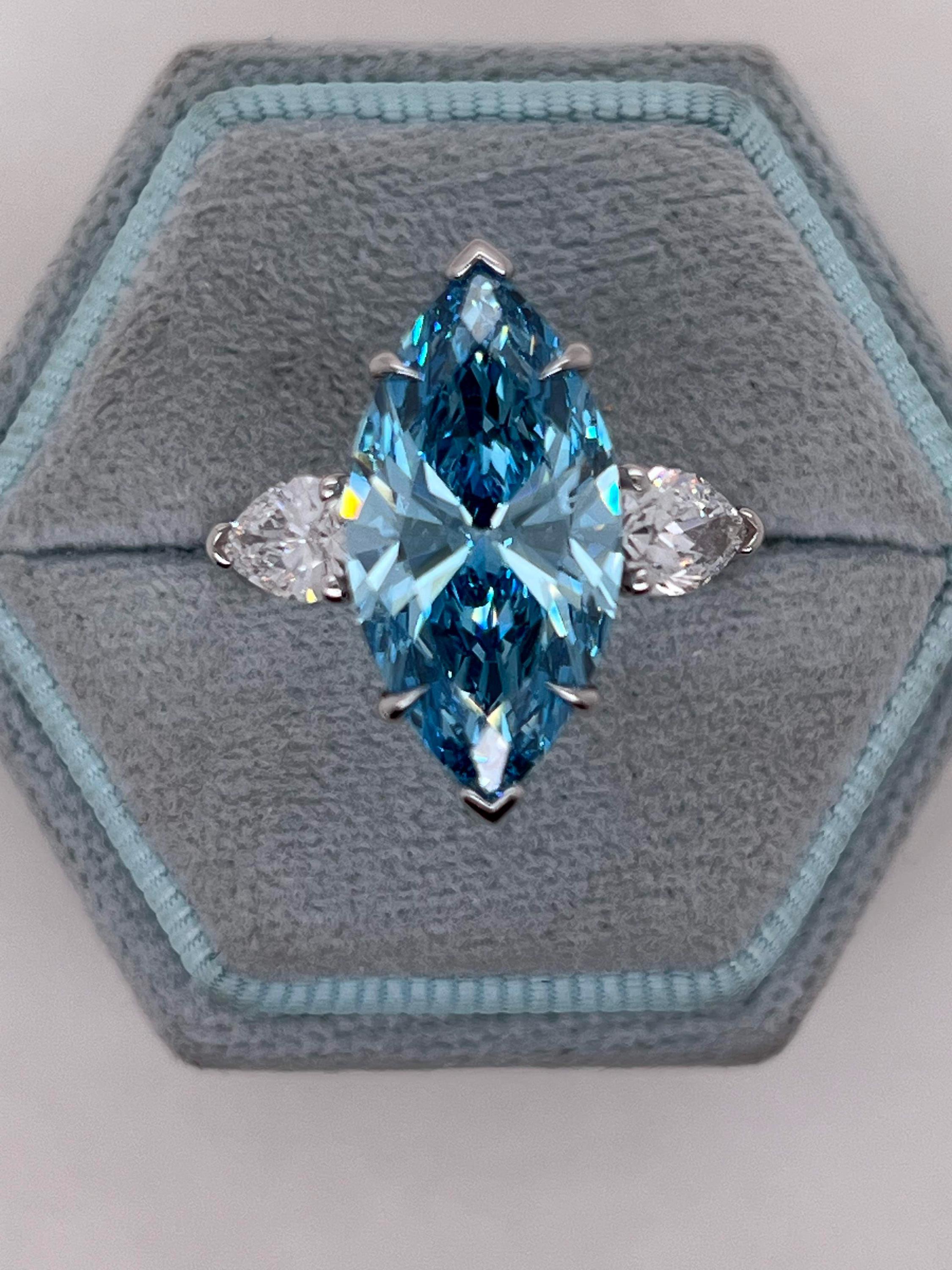 7 Carat Fancy Vivid Blue Color Marquise Three Stone Engagement Ring Side Pear Diamonds