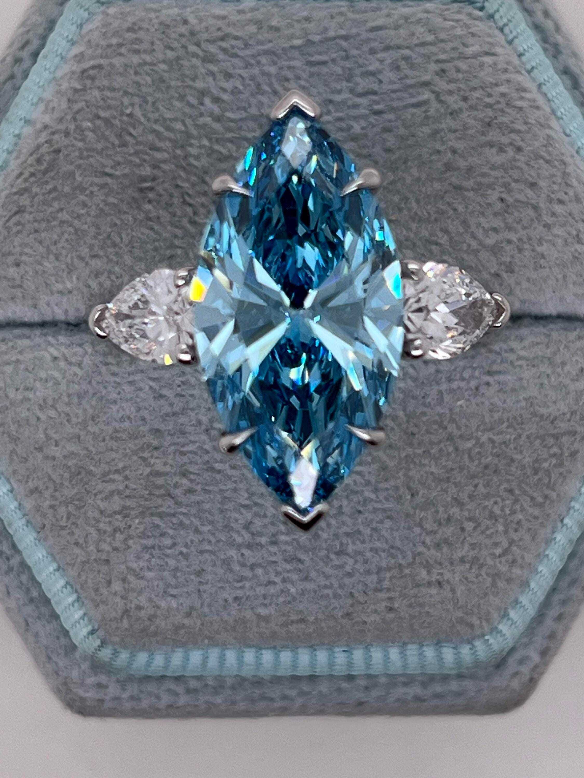 7 Carat Fancy Vivid Blue Color Marquise Three Stone Engagement Ring Side Pear Diamonds