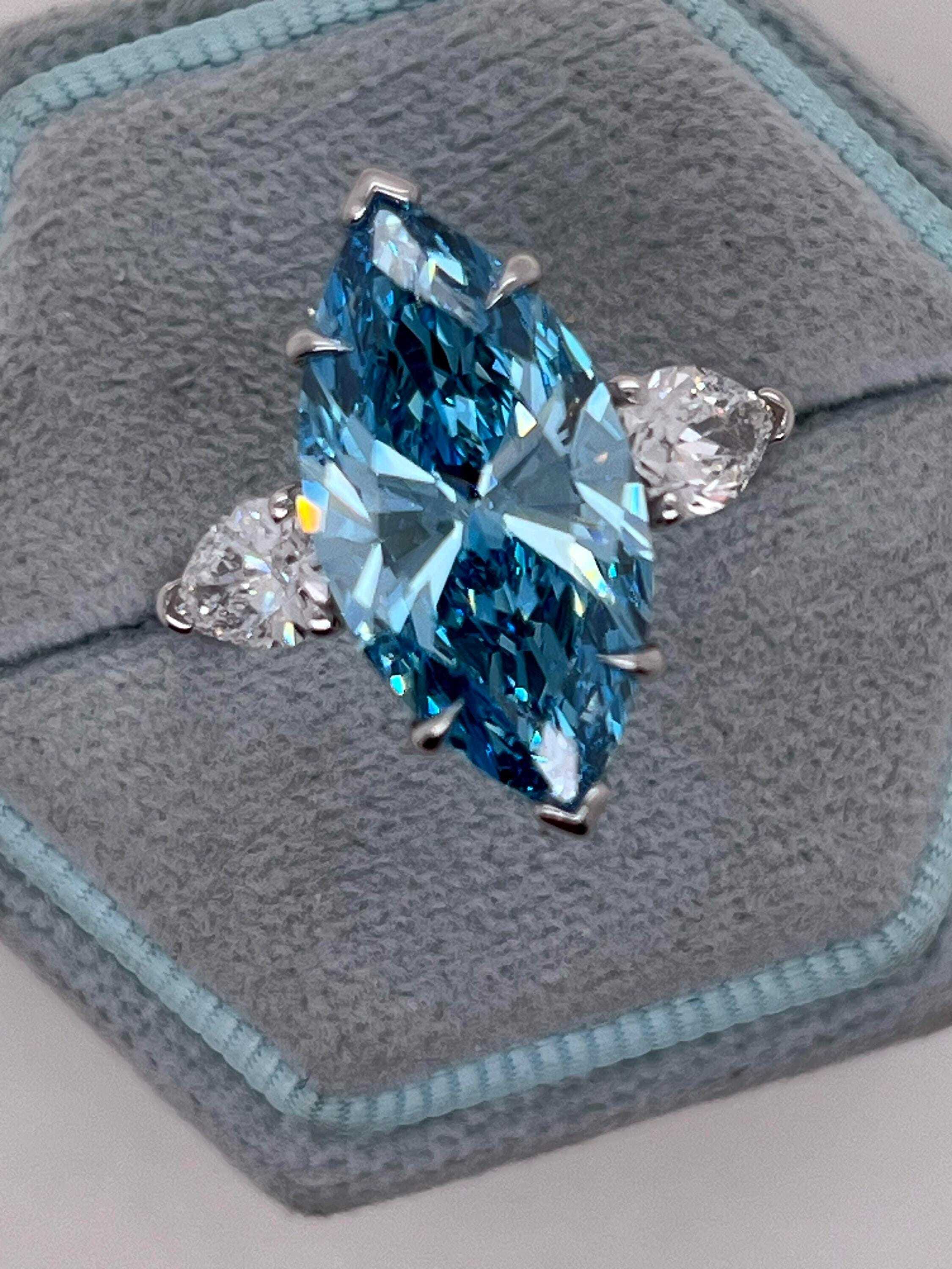 7 Carat Fancy Vivid Blue Color Marquise Three Stone Engagement Ring Side Pear Diamonds
