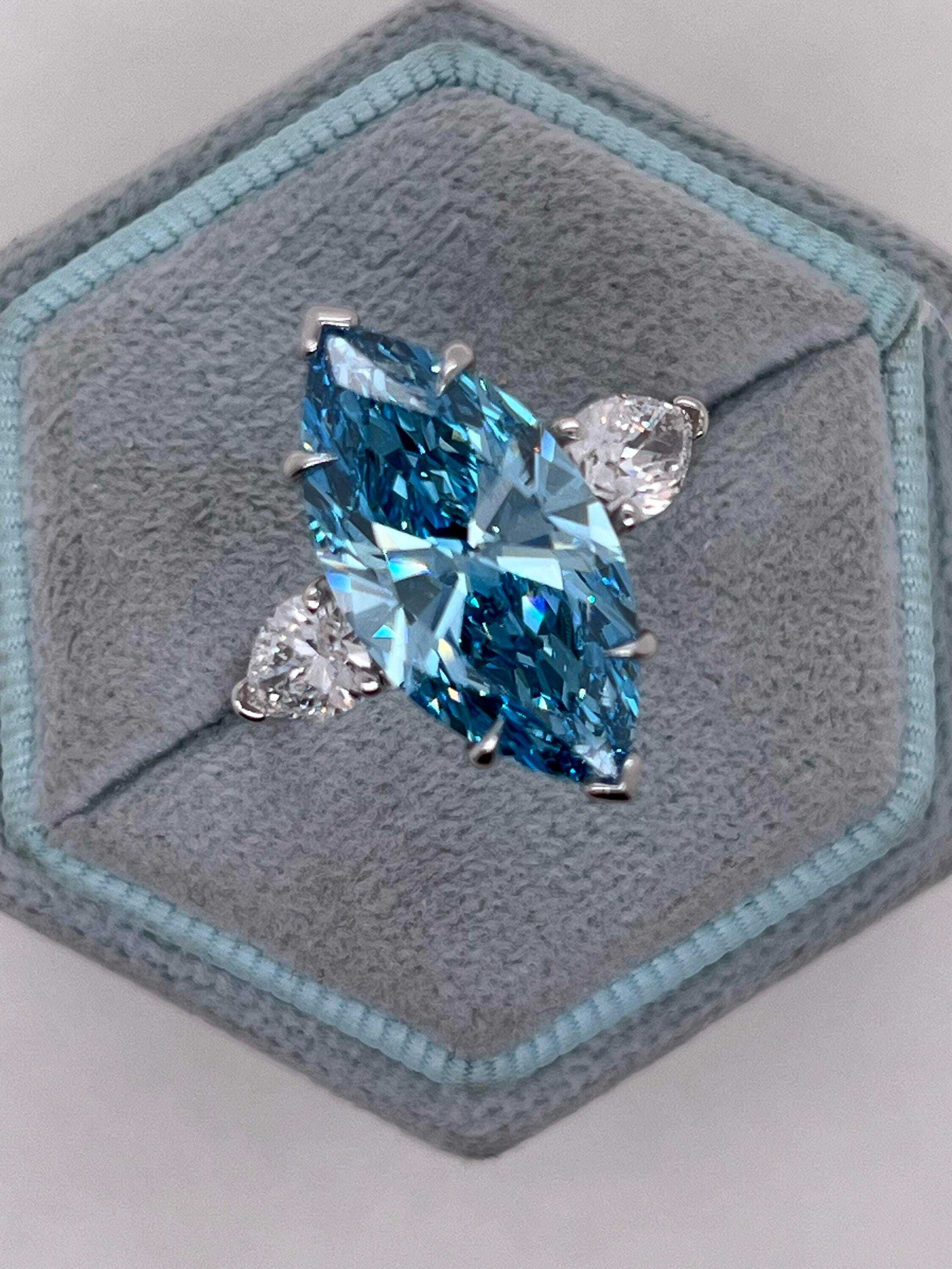7 Carat Fancy Vivid Blue Color Marquise Three Stone Engagement Ring Side Pear Diamonds