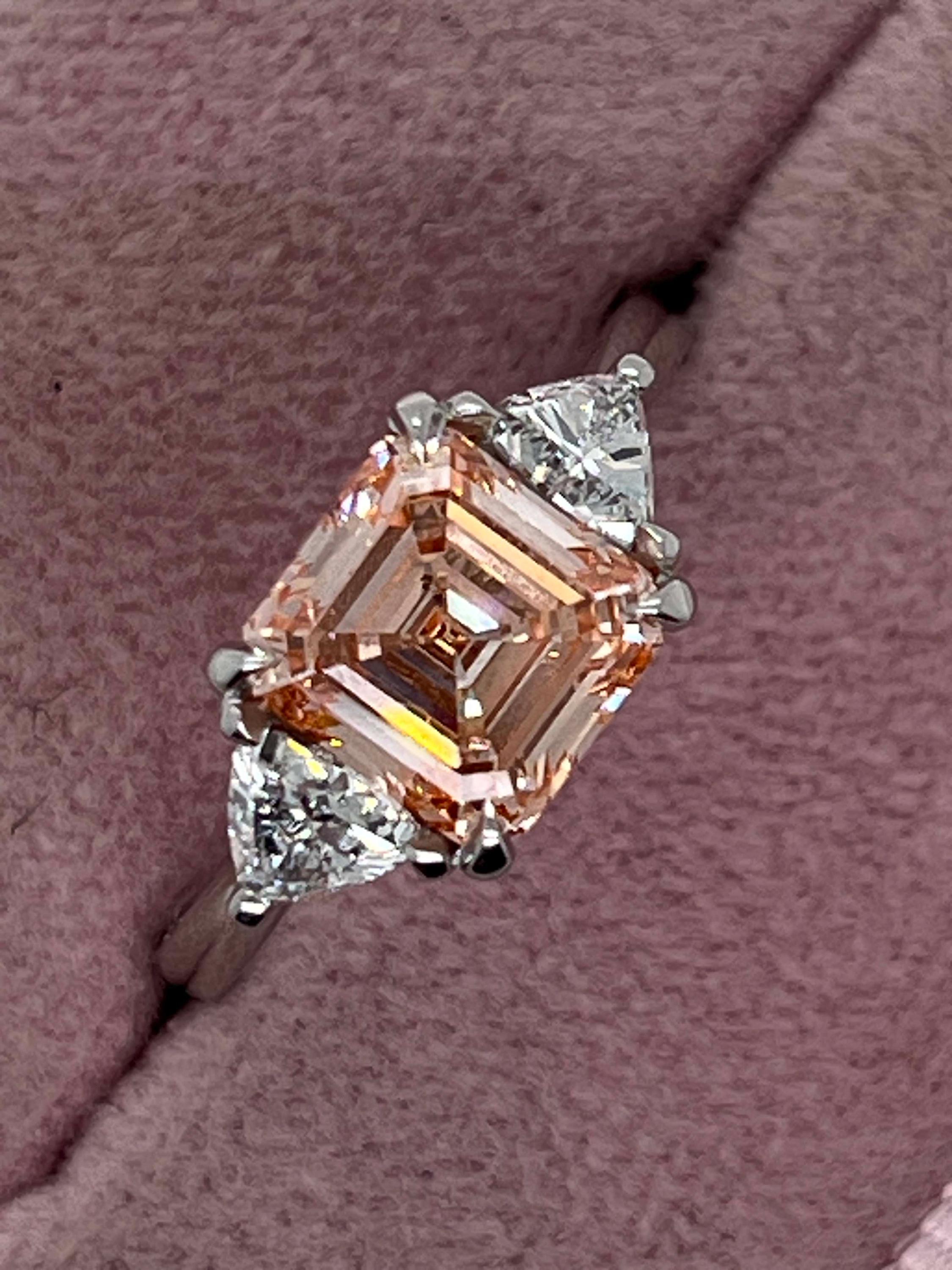 2.5 Carat Fancy Vivid Pink Asscher Cut Three Diamond Engagement Ring Side Trillions