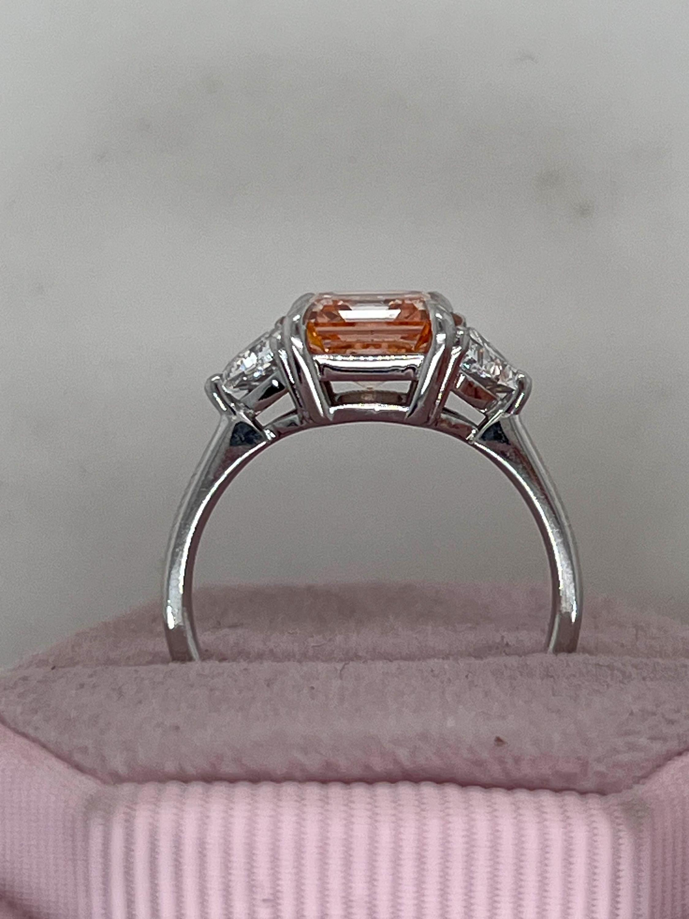 2.5 Carat Fancy Vivid Pink Asscher Cut Three Diamond Engagement Ring Side Trillions