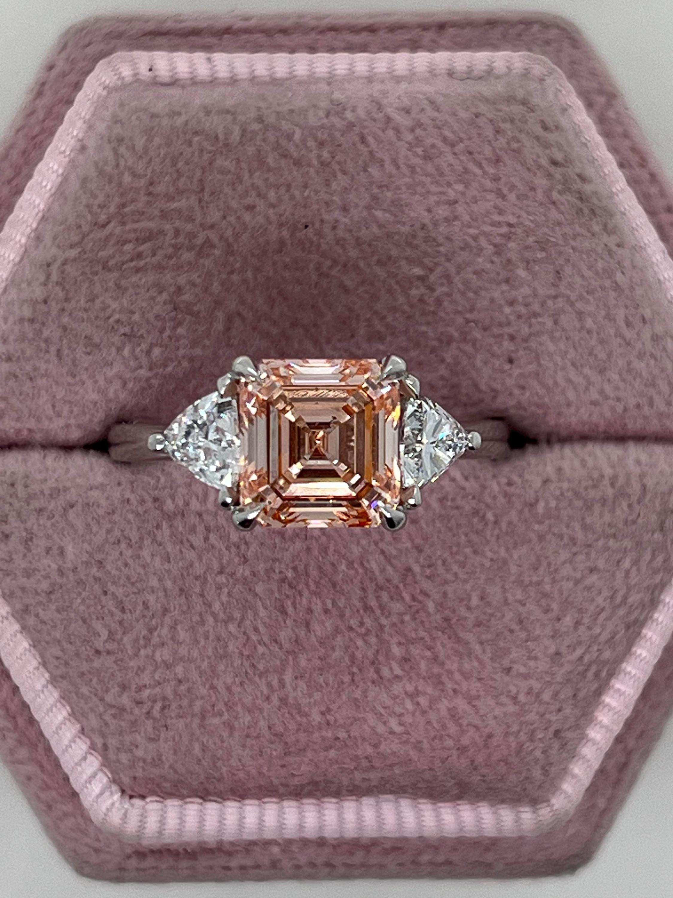 2.5 Carat Fancy Vivid Pink Asscher Cut Three Diamond Engagement Ring Side Trillions