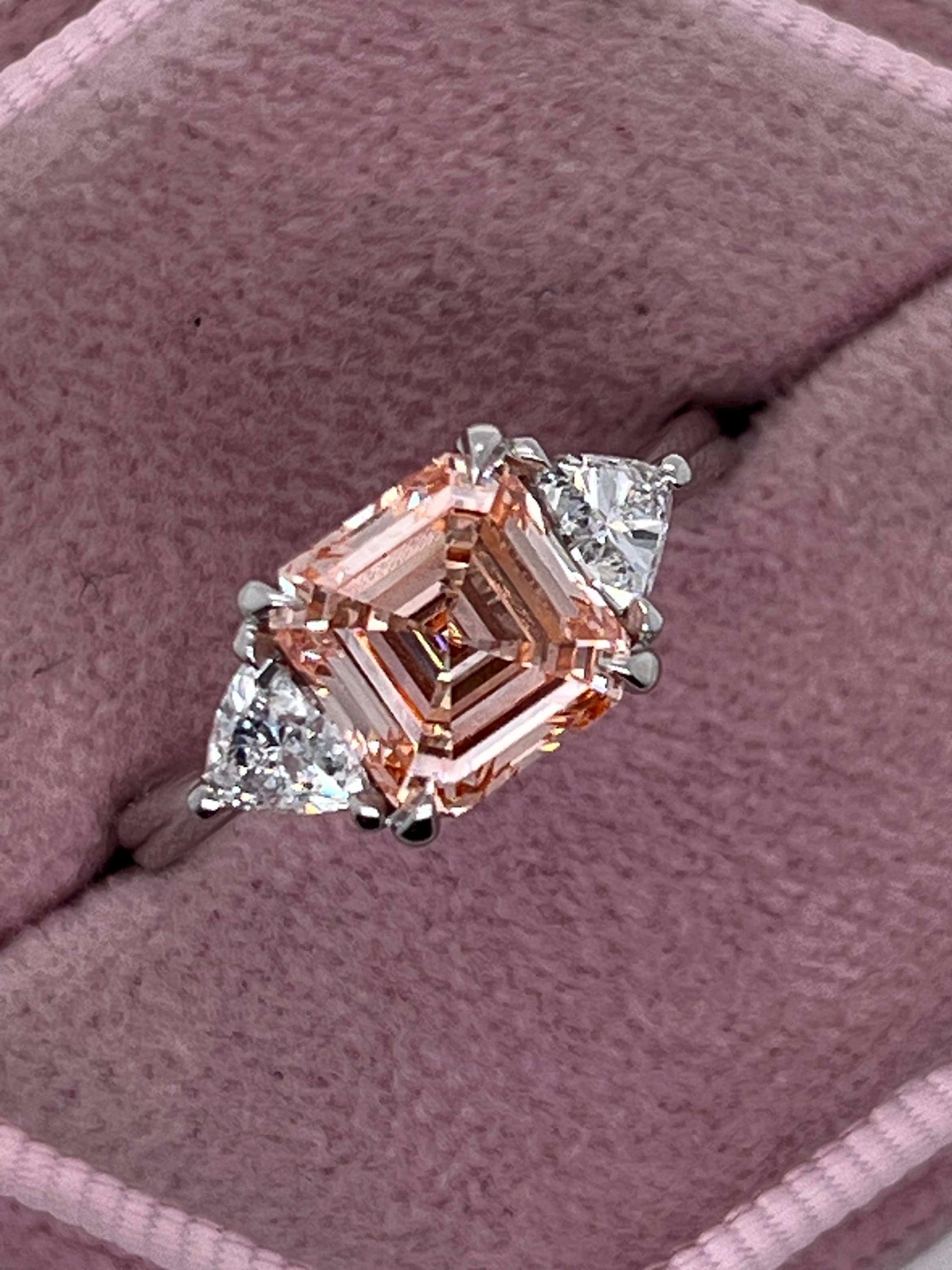 2.5 Carat Fancy Vivid Pink Asscher Cut Three Diamond Engagement Ring Side Trillions