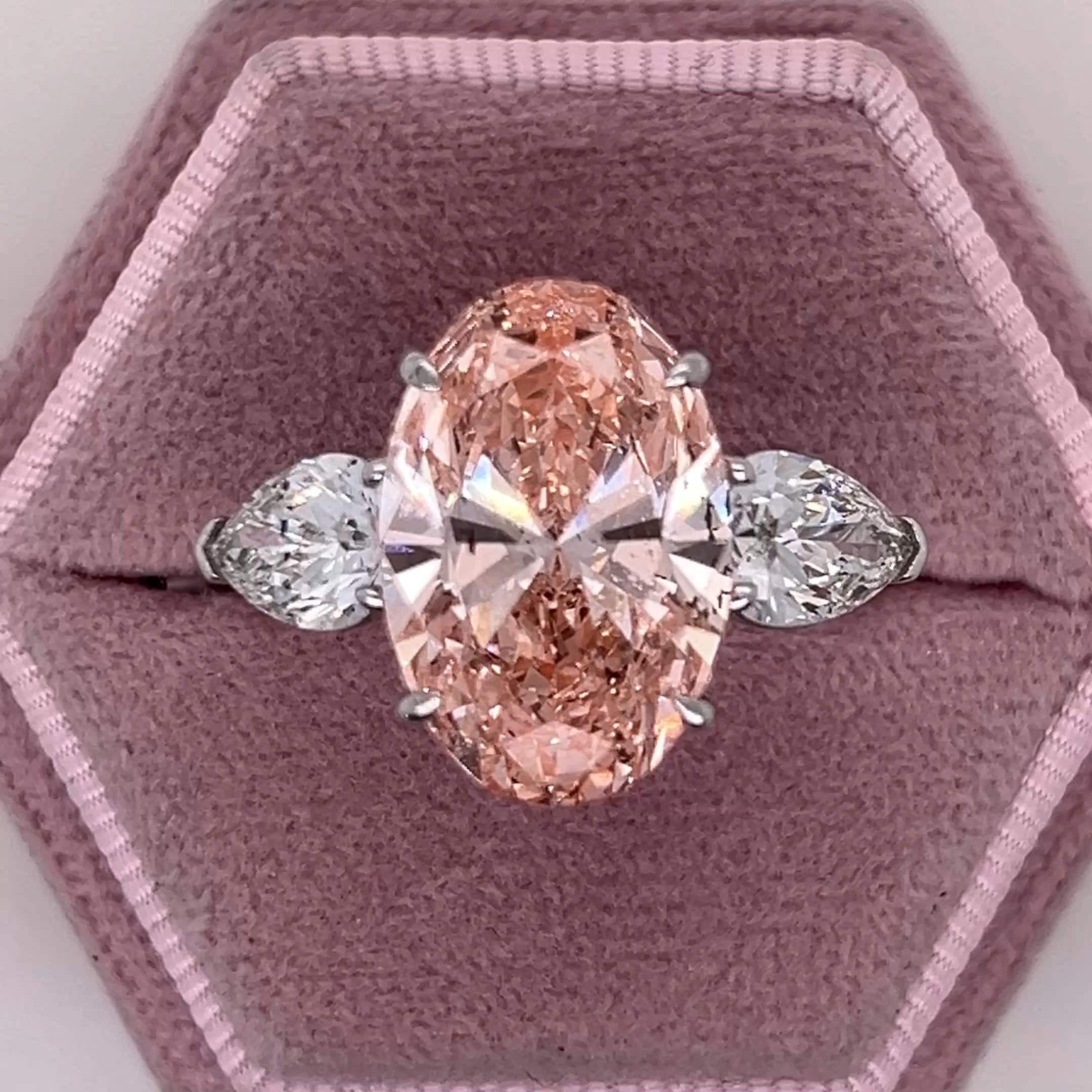 9 Carat Total Fancy Vivid Pink Oval Cut Three Stone Engagement Ring, Side Pear Diamonds