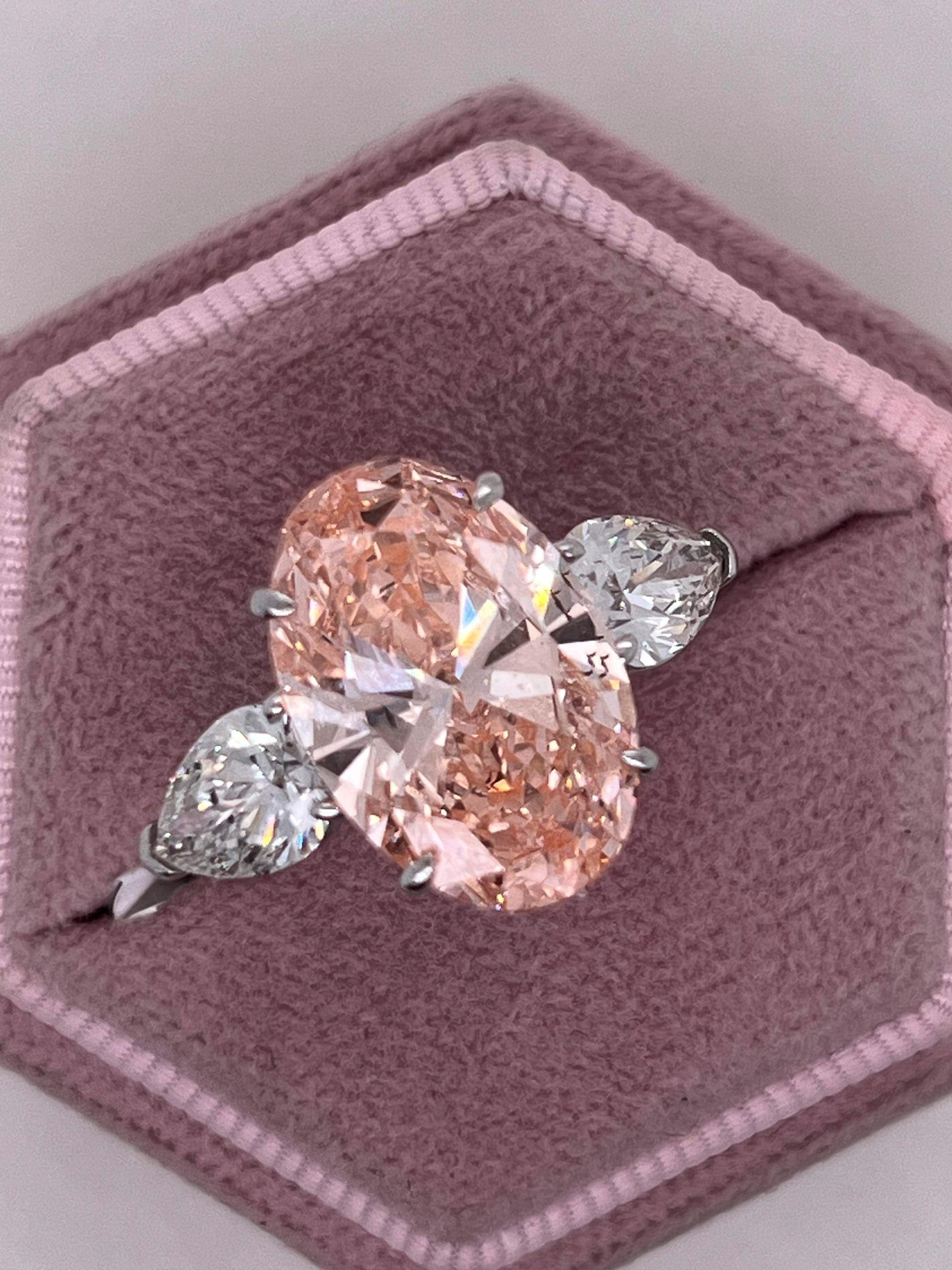 9 Carat Total Fancy Vivid Pink Oval Cut Three Stone Engagement Ring, Side Pear Diamonds