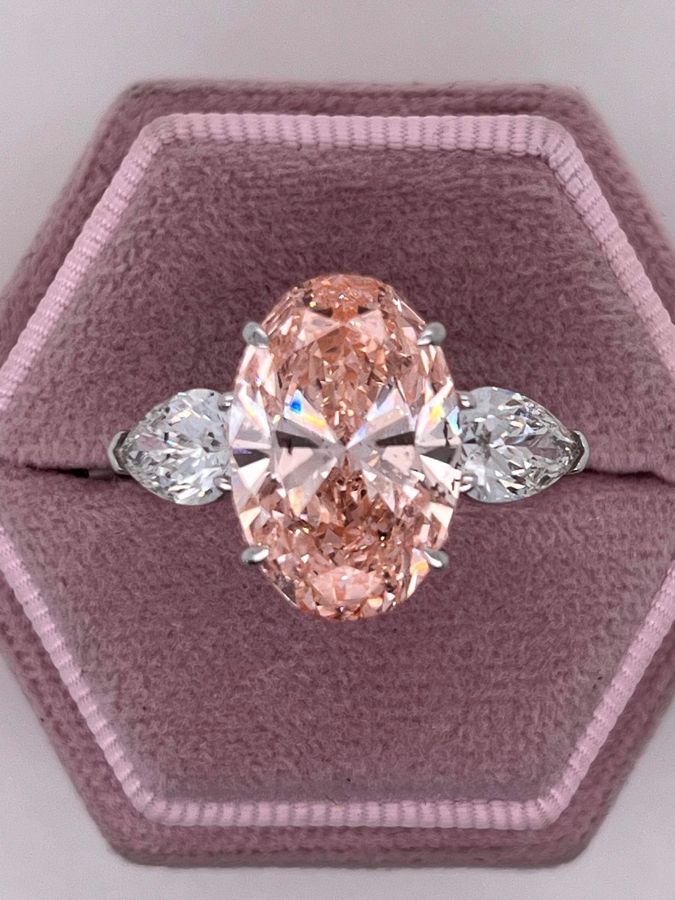 9 Carat Total Fancy Vivid Pink Oval Cut Three Stone Engagement Ring, Side Pear Diamonds