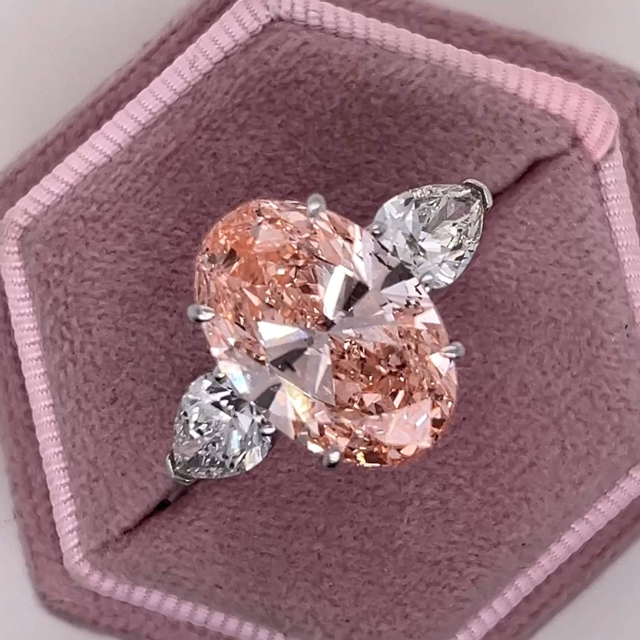 9 Carat Total Fancy Vivid Pink Oval Cut Three Stone Engagement Ring, Side Pear Diamonds