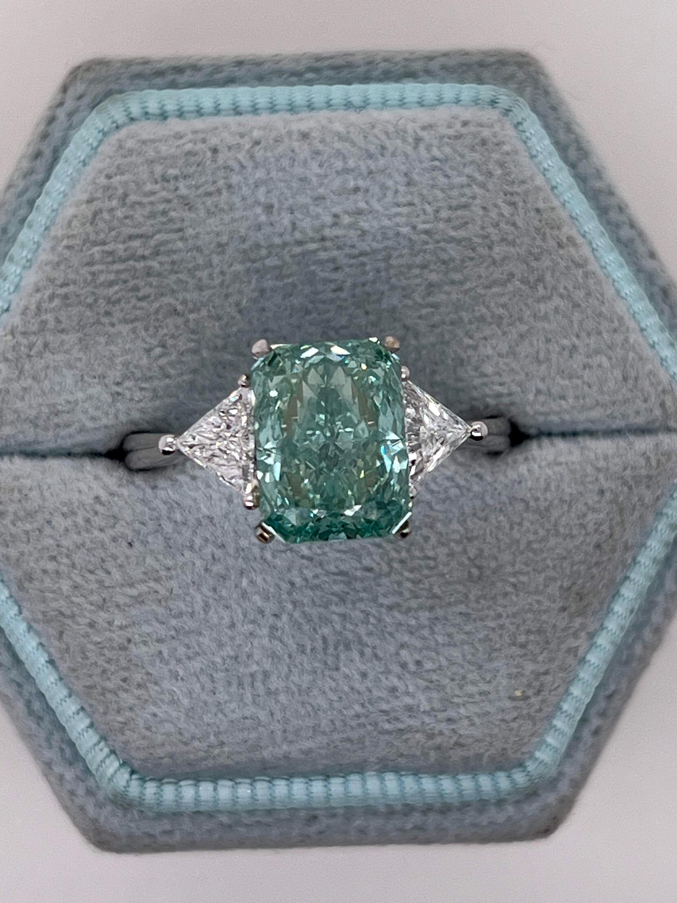 3.5 Carat Fancy Vivid Green Radiant Cut Diamond Three Stone Engagement Ring Side Trillions