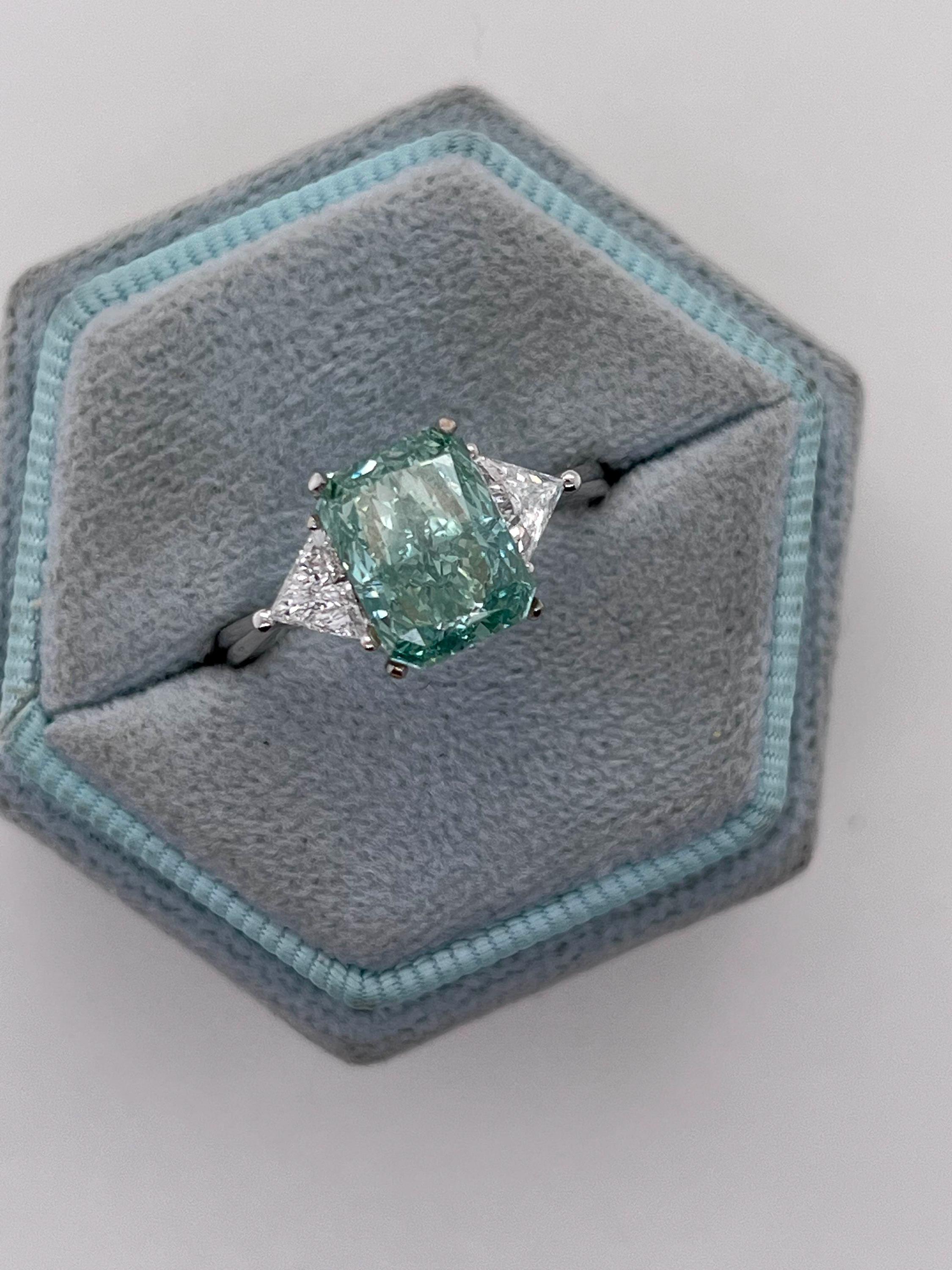 3.5 Carat Fancy Vivid Green Radiant Cut Diamond Three Stone Engagement Ring Side Trillions
