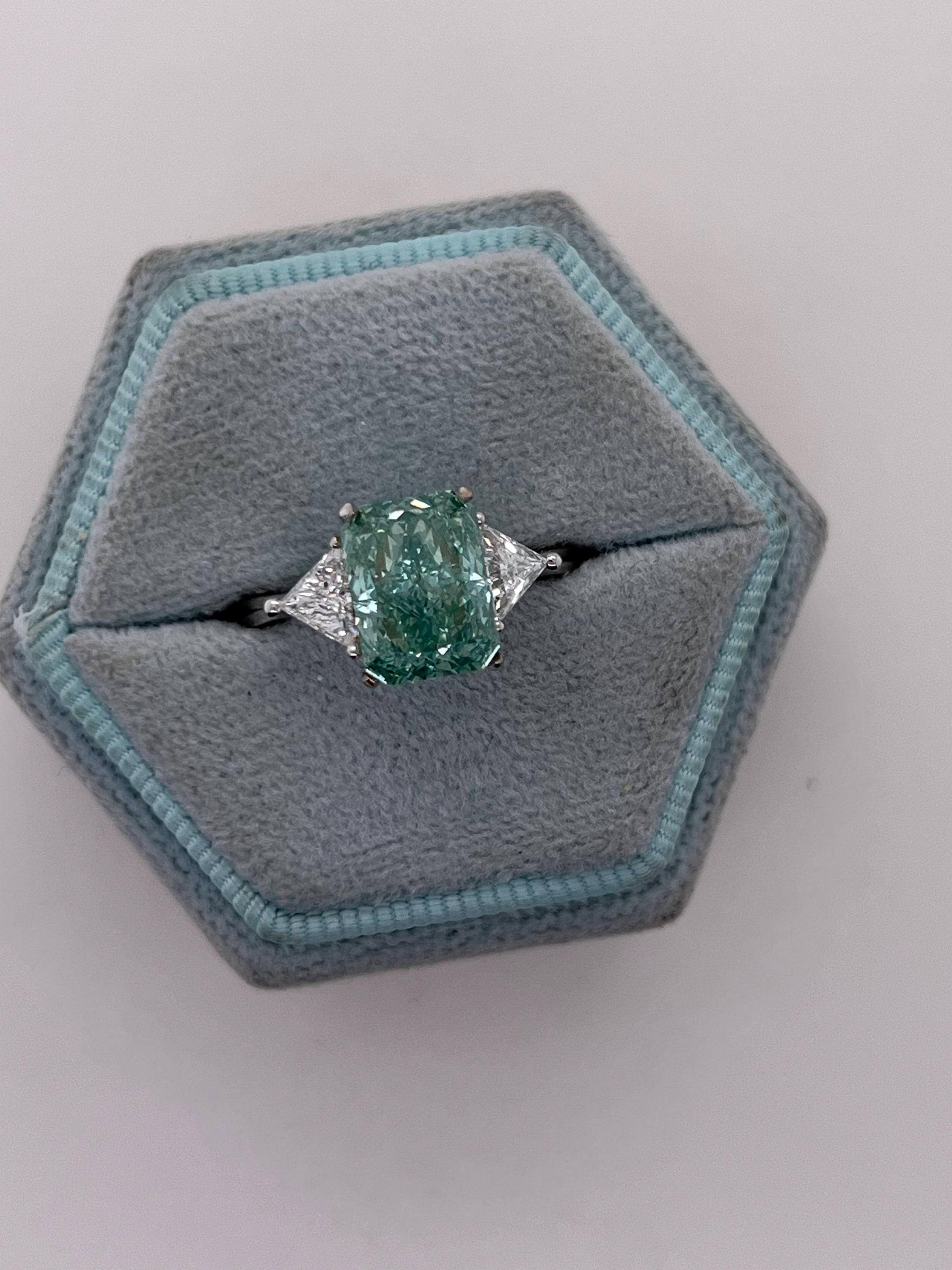 3.5 Carat Fancy Vivid Green Radiant Cut Diamond Three Stone Engagement Ring Side Trillions