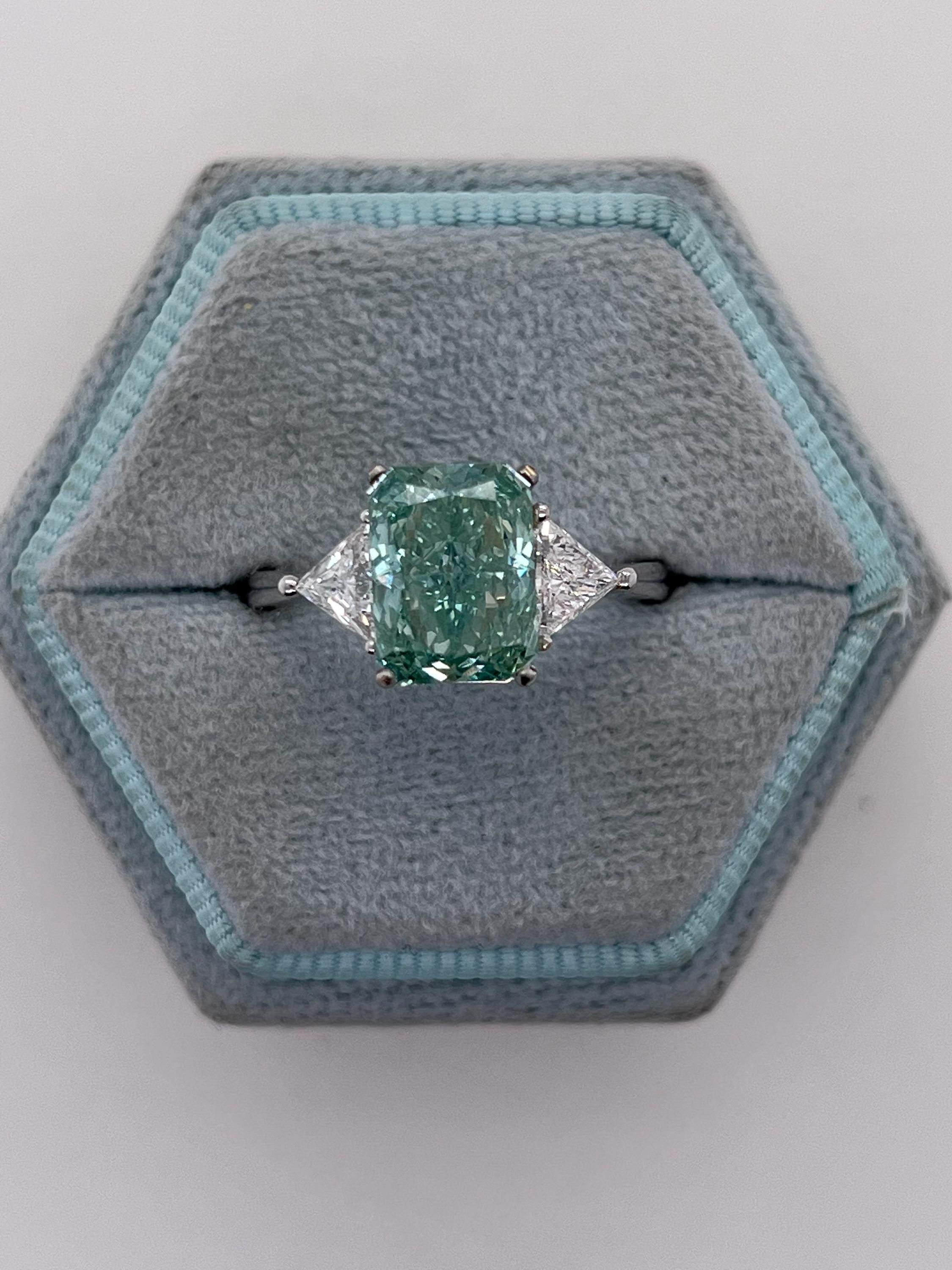 3.5 Carat Fancy Vivid Green Radiant Cut Diamond Three Stone Engagement Ring Side Trillions