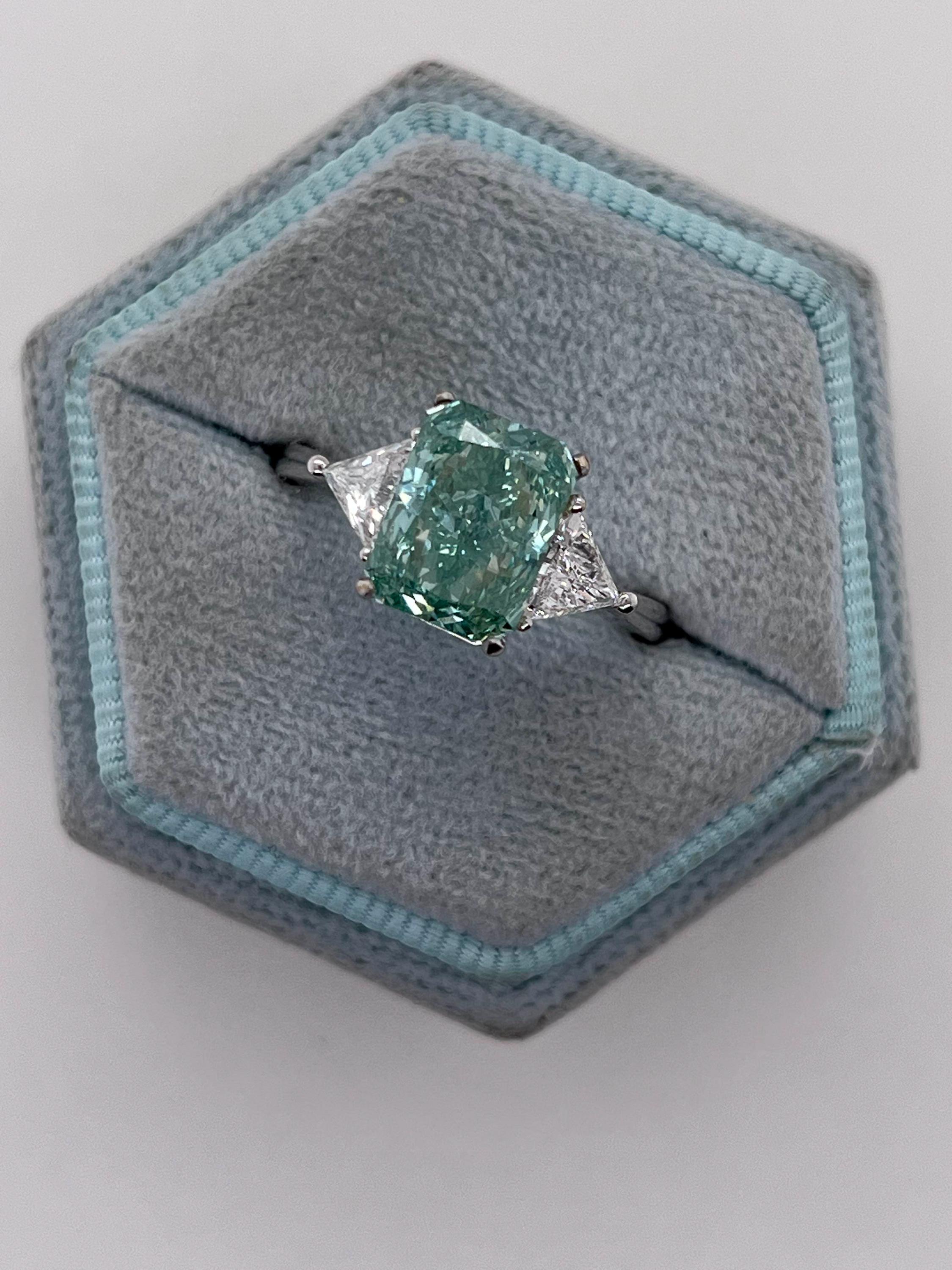 3.5 Carat Fancy Vivid Green Radiant Cut Diamond Three Stone Engagement Ring Side Trillions