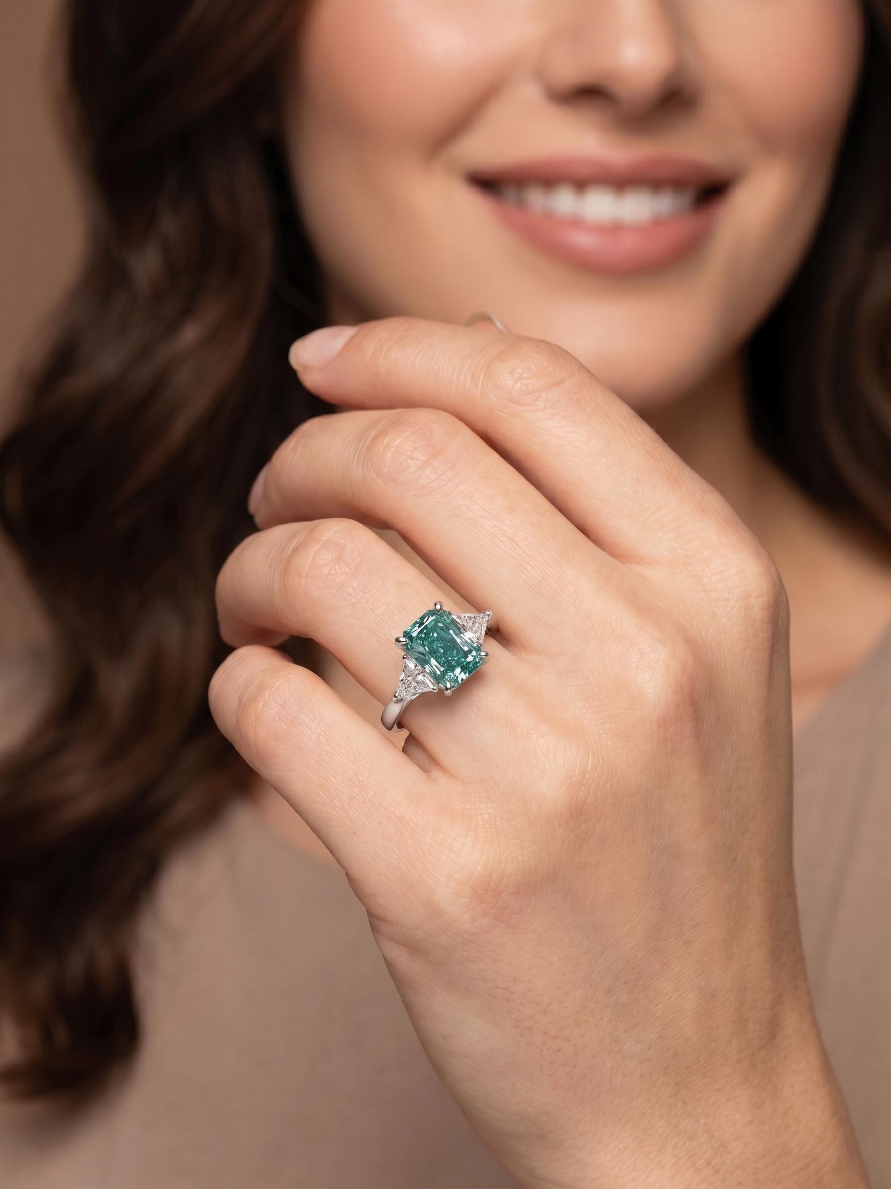 3.5 Carat Fancy Vivid Green Radiant Cut Diamond Three Stone Engagement Ring Side Trillions