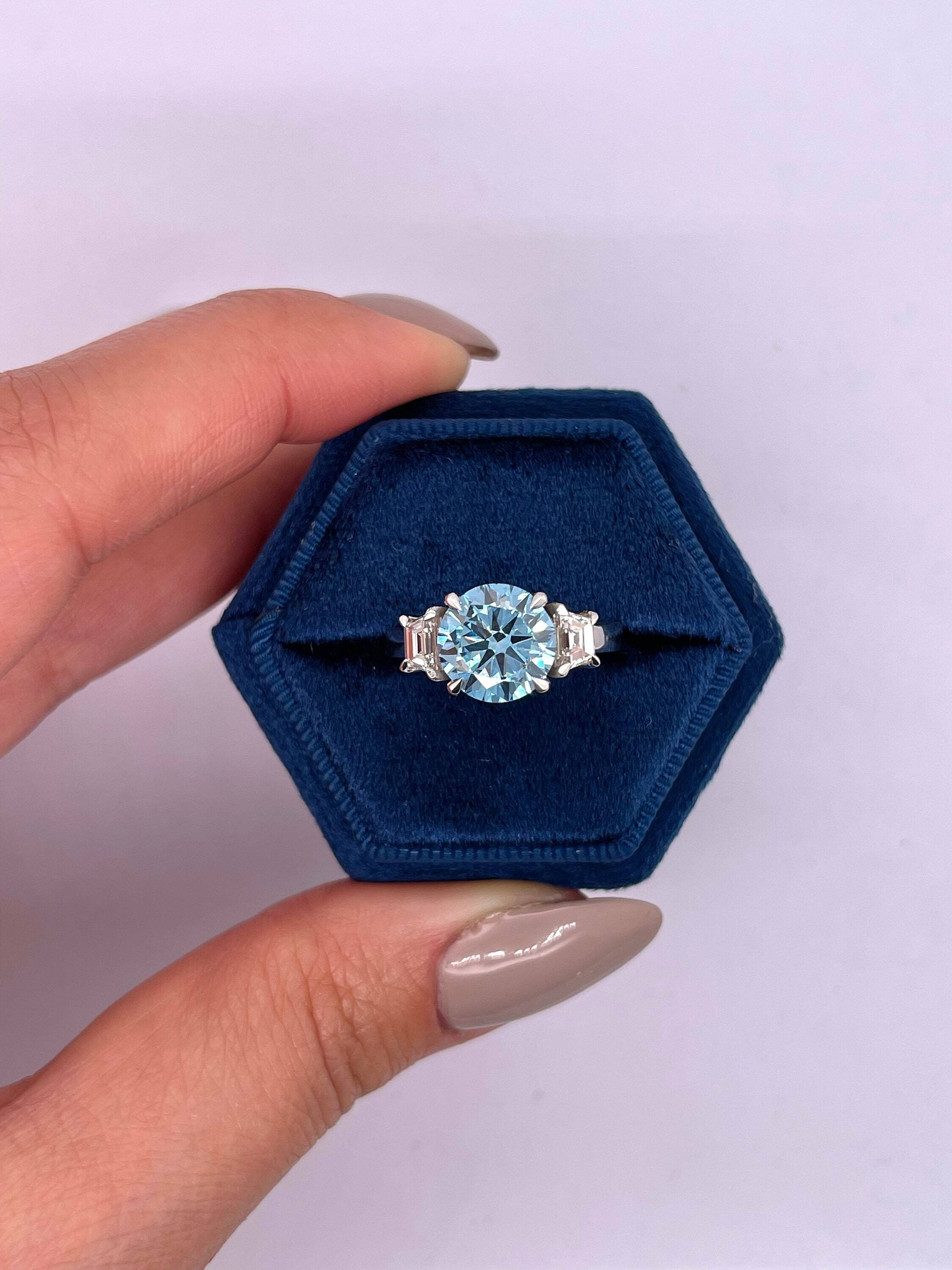2.5 Carat Fancy Vivid Blue Round Cut Three Stone Diamond Engagement Ring, Side Trapezoid Diamonds