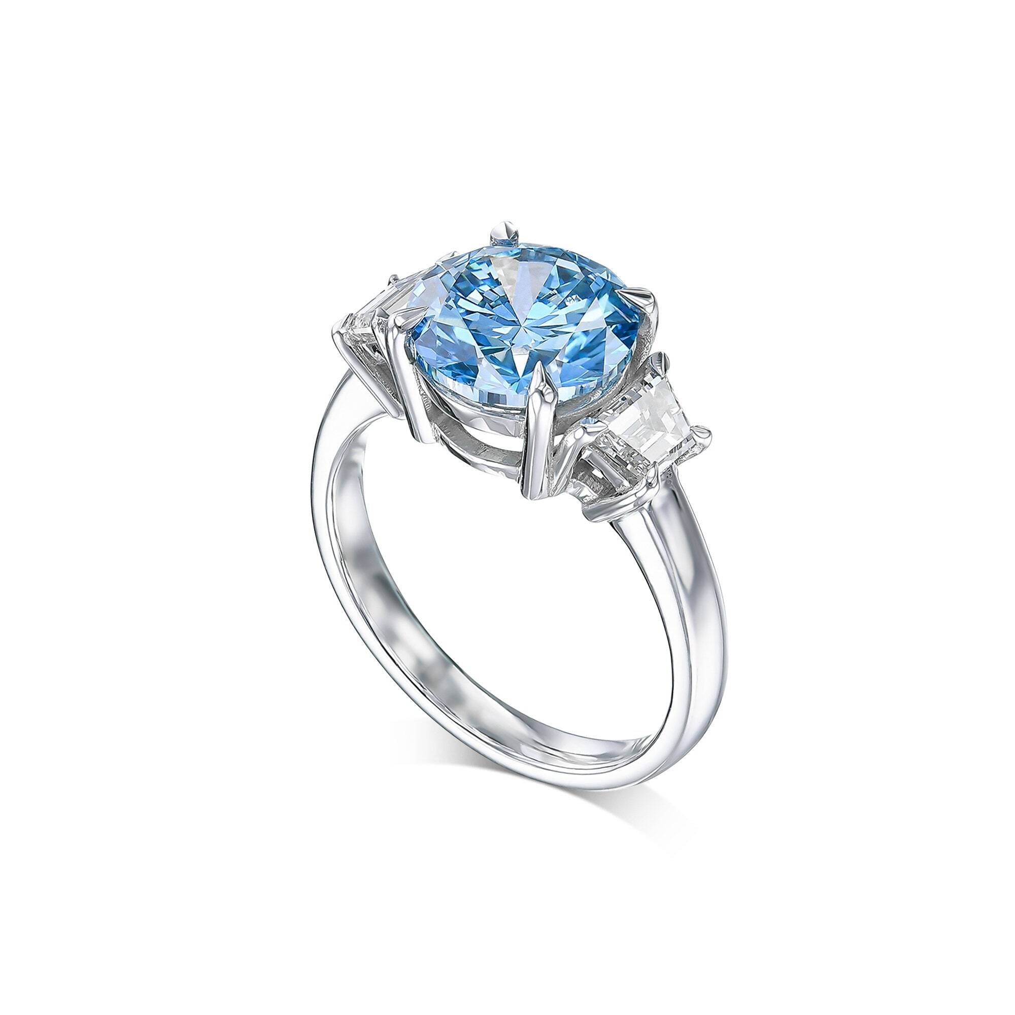 2.5 Carat Fancy Vivid Blue Round Cut Three Stone Diamond Engagement Ring, Side Trapezoid Diamonds