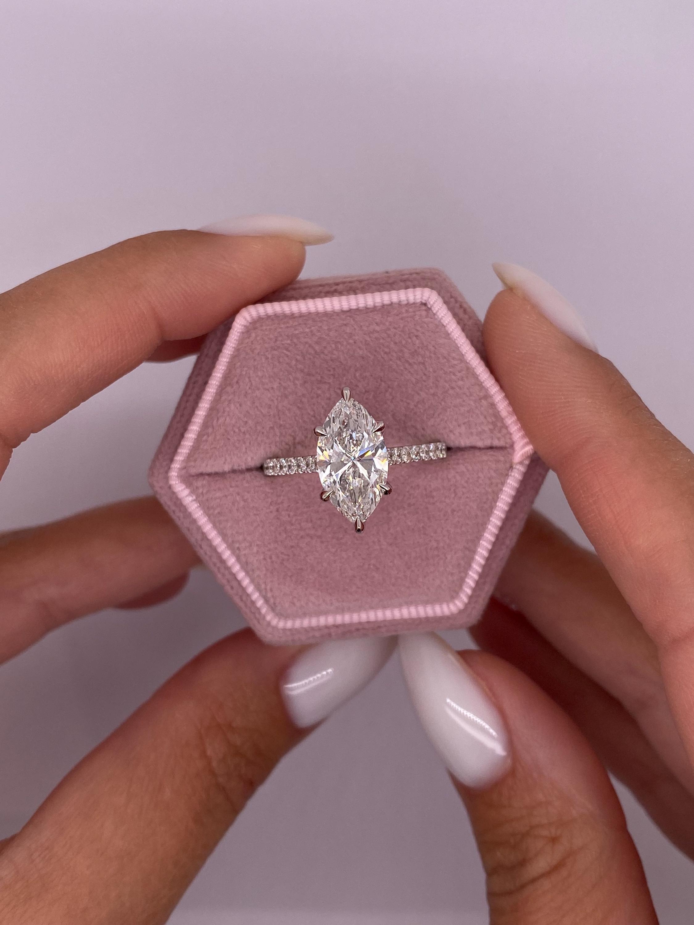 Unique 4.50 carat Marquise Cut Diamond Hidden Halo Cathedral Set Engagement Ring