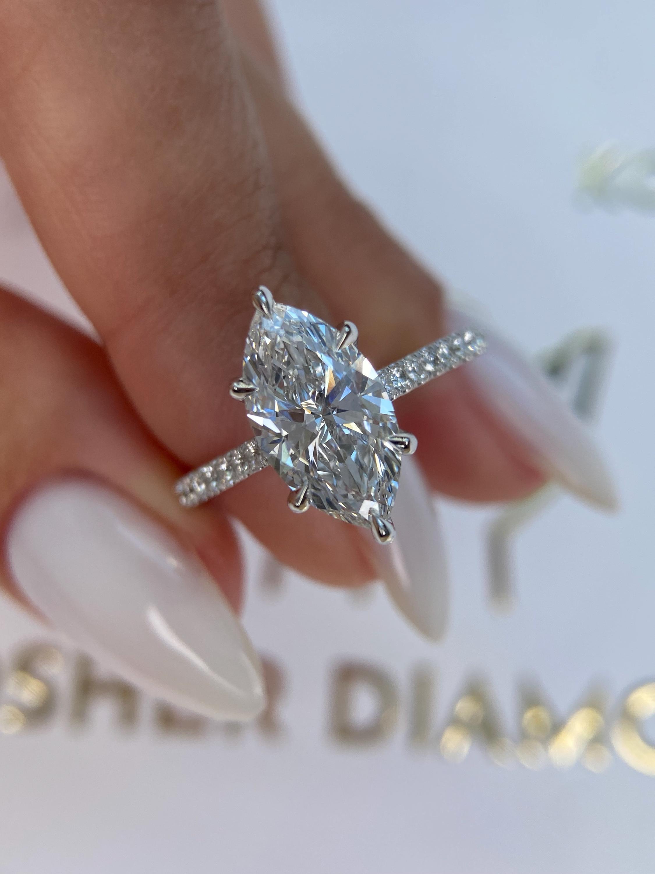 Unique 4.50 carat Marquise Cut Diamond Hidden Halo Cathedral Set Engagement Ring
