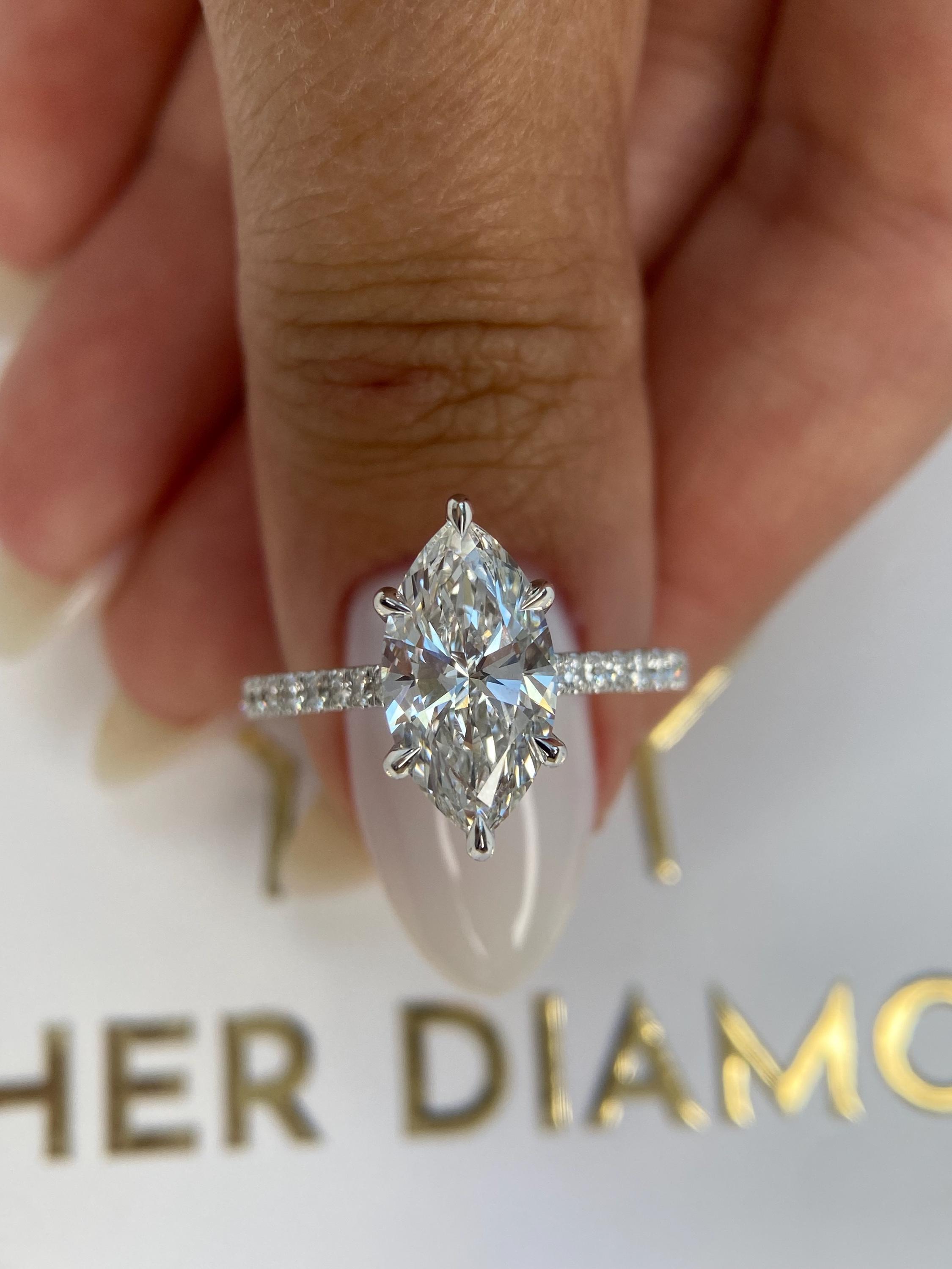 Unique 4.50 carat Marquise Cut Diamond Hidden Halo Cathedral Set Engagement Ring