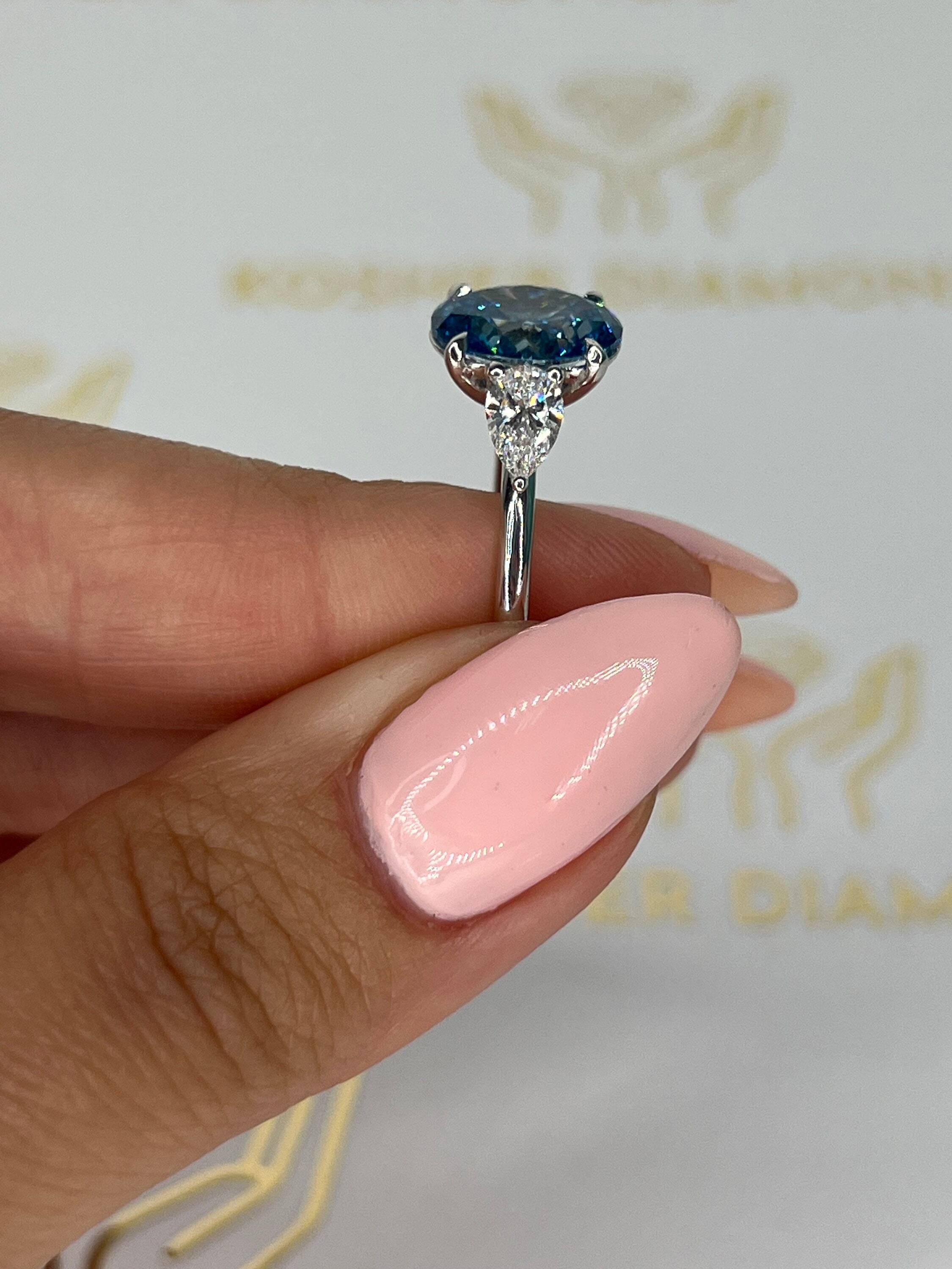 3.5 Carat Fancy Vivid Blue Oval Cut Three Stone Diamond Engagement Ring Side Pears