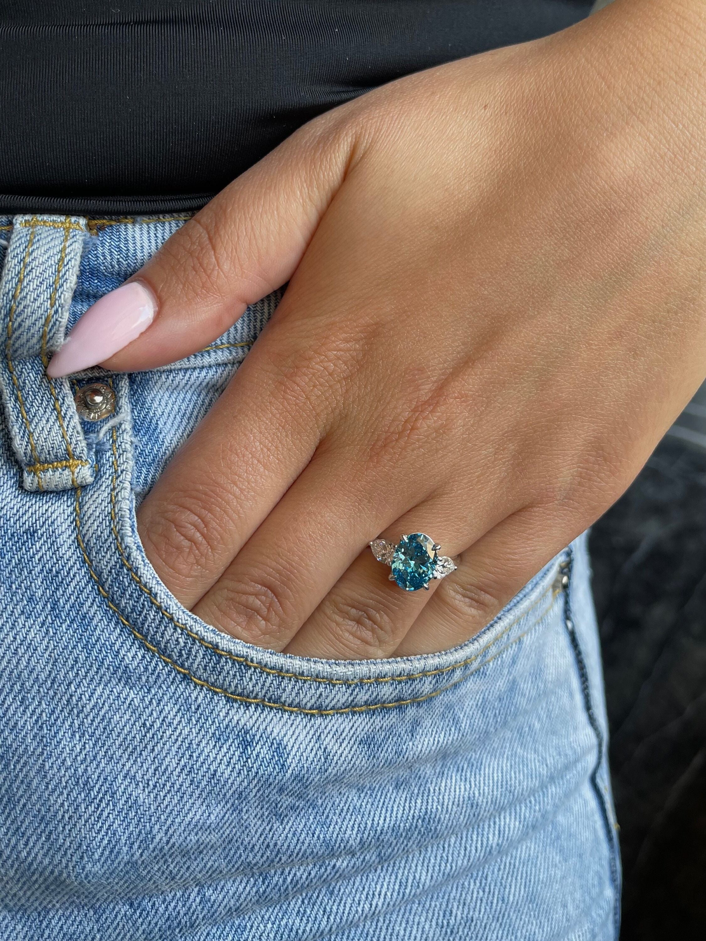 3.5 Carat Fancy Vivid Blue Oval Cut Three Stone Diamond Engagement Ring Side Pears