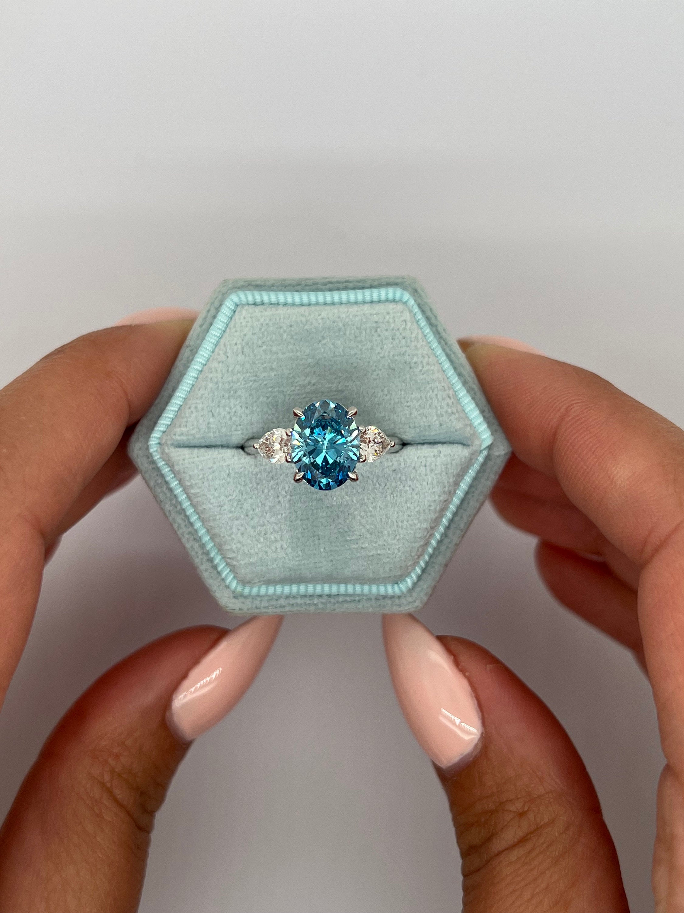 3.5 Carat Fancy Vivid Blue Oval Cut Three Stone Diamond Engagement Ring Side Pears