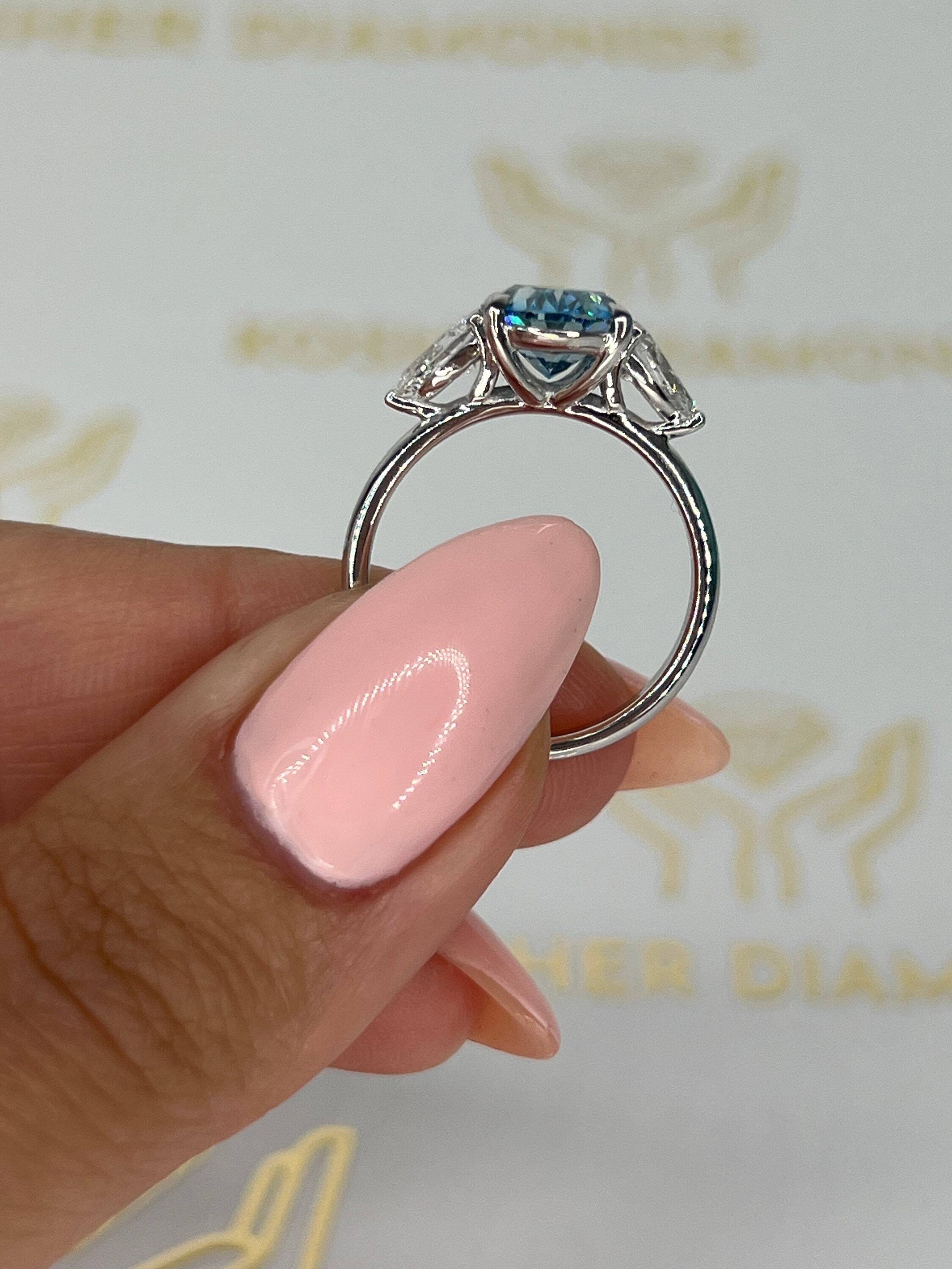 3.5 Carat Fancy Vivid Blue Oval Cut Three Stone Diamond Engagement Ring Side Pears