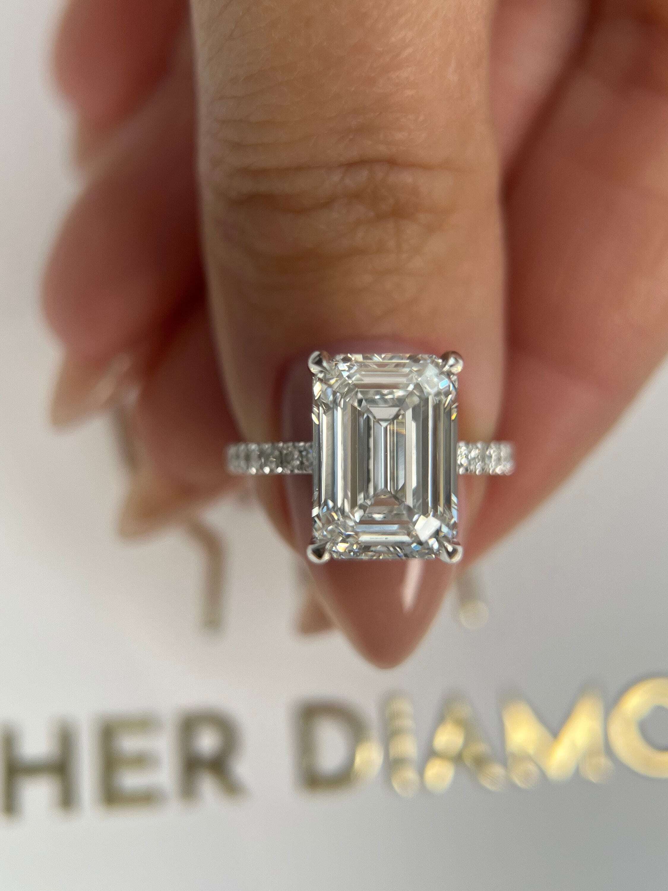 5.3 Carat Emerald Cut Diamond Solitaire Hidden Halo Engagement Ring, Side Round Diamonds