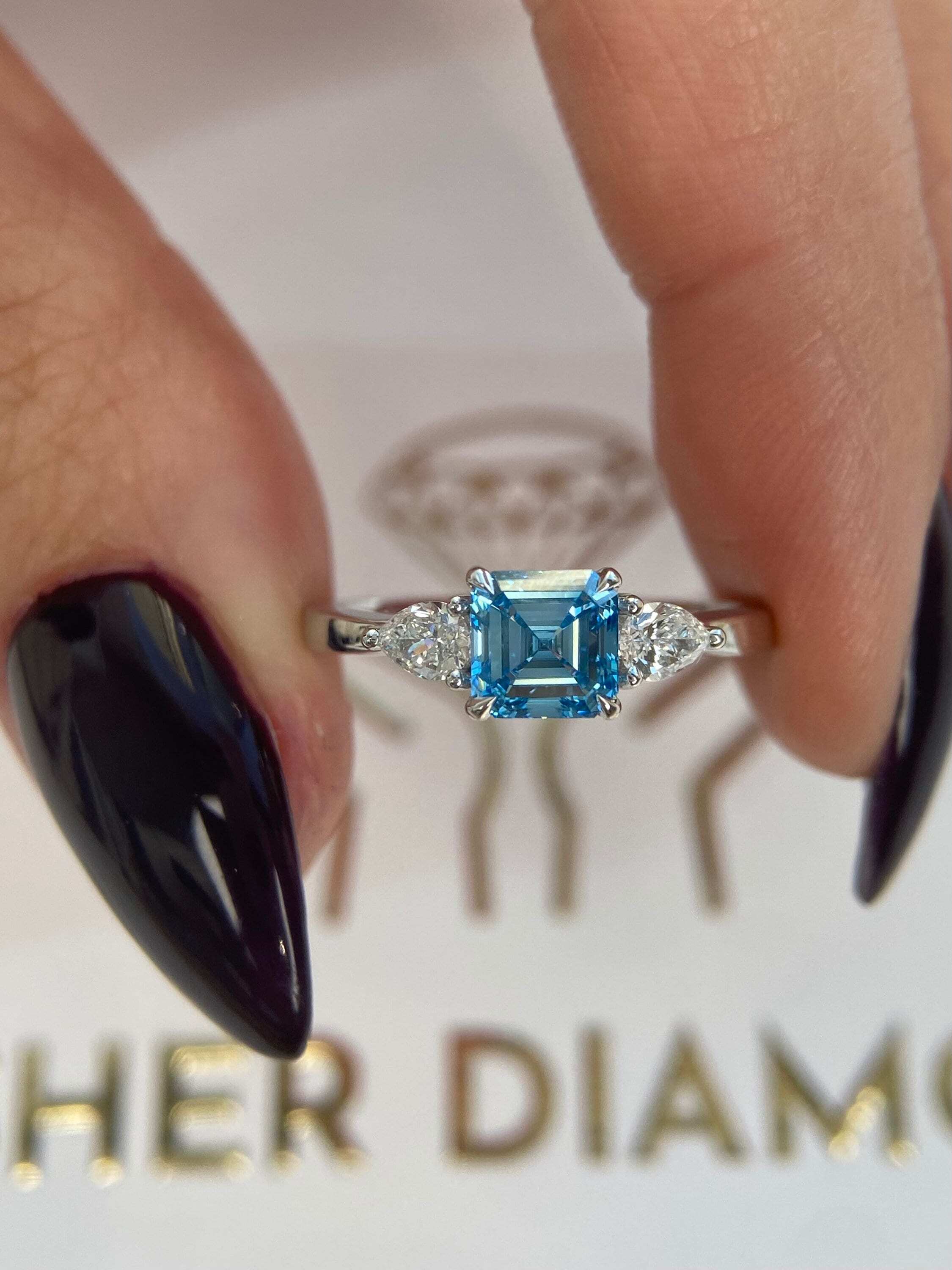1.3 Carat Fancy Vivid Blue Asscher Cut Diamond Three Stone Engagement Ring, Side Pear Diamonds