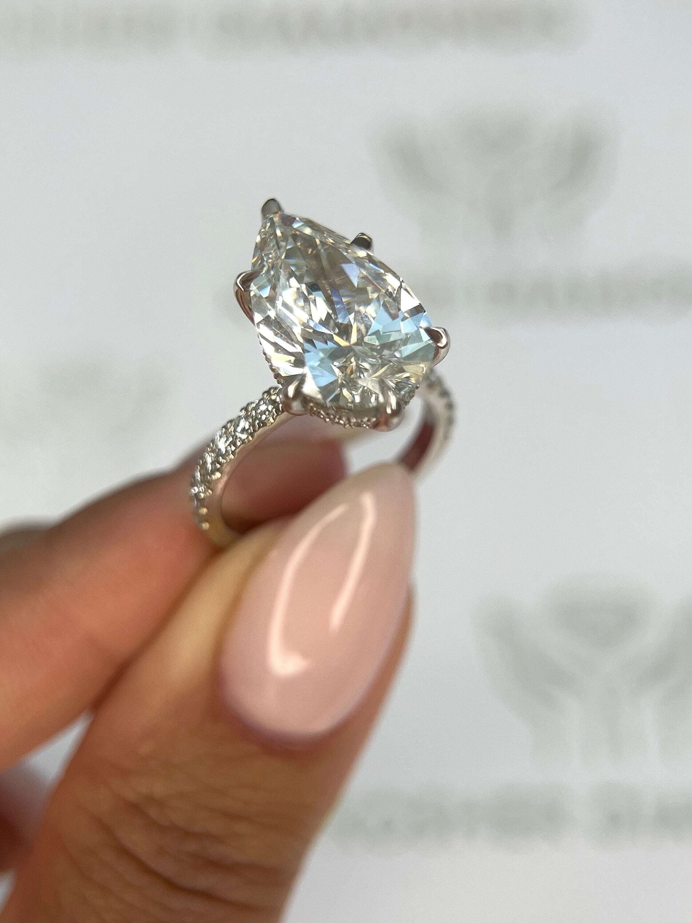 7.5 Carat Pear Cut Hidden Halo Diamond Engagement Ring with Pavé Diamonds