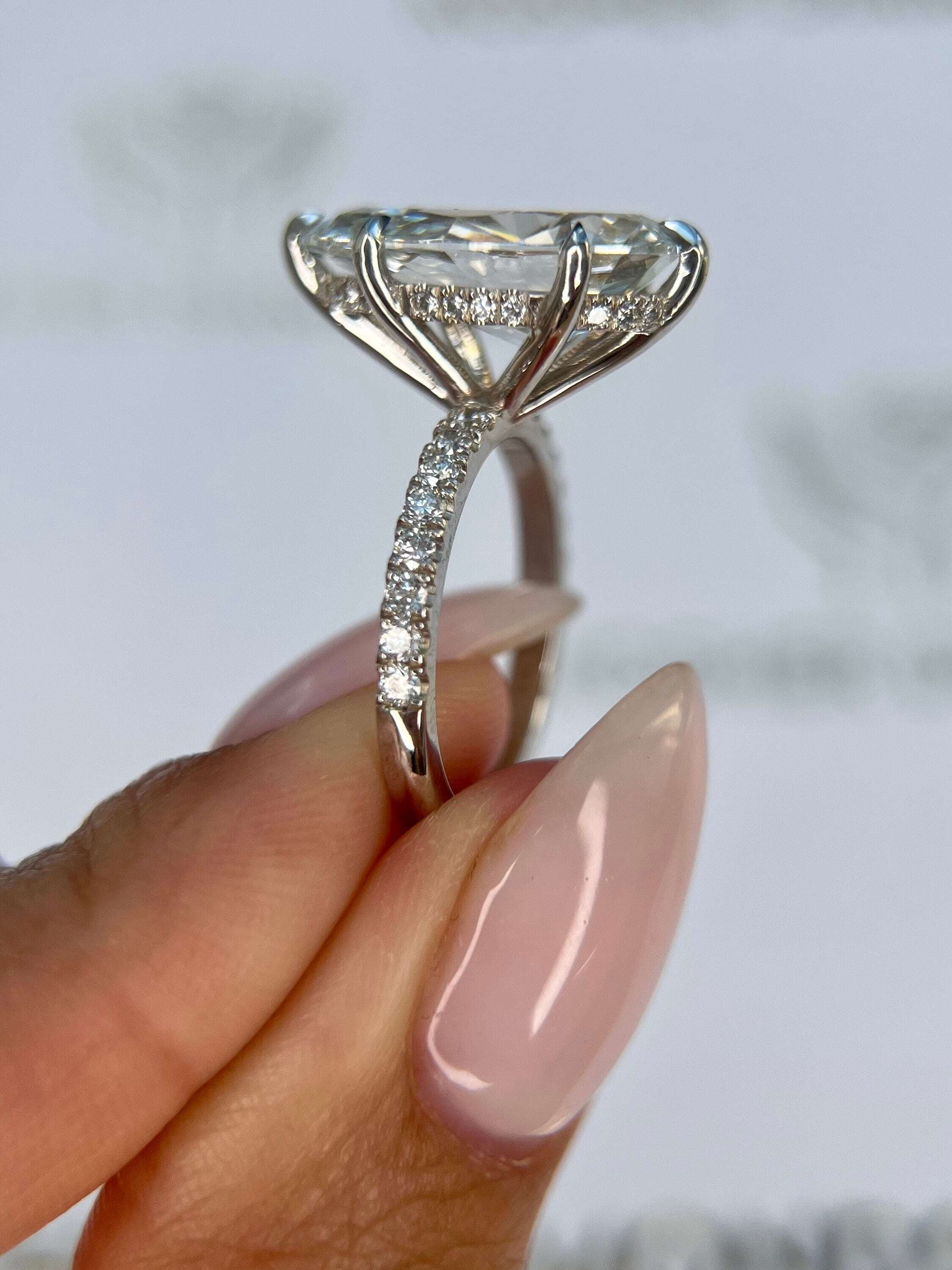 7.5 Carat Pear Cut Hidden Halo Diamond Engagement Ring with Pavé Diamonds
