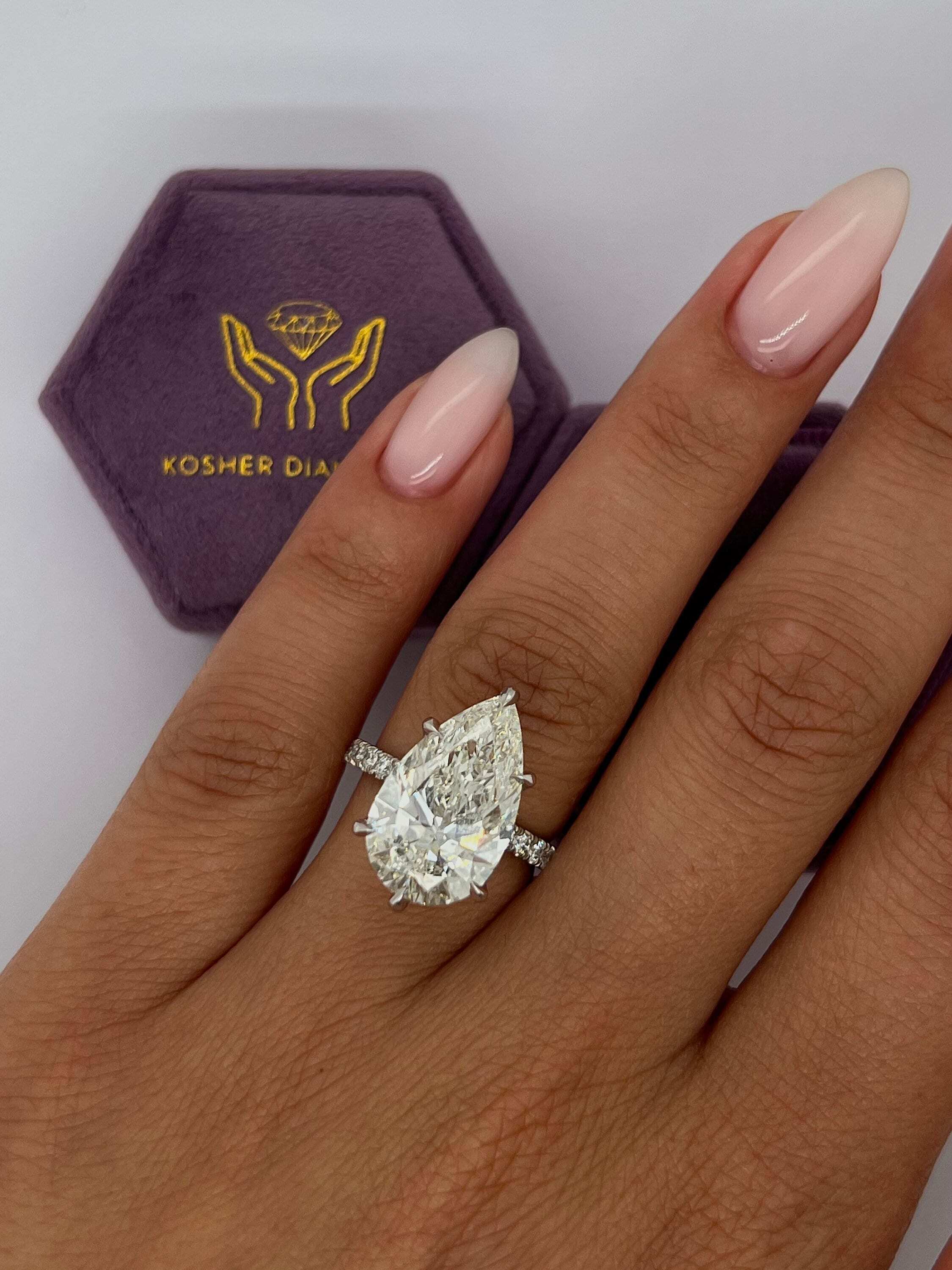 7.5 Carat Pear Cut Hidden Halo Diamond Engagement Ring with Pavé Diamonds