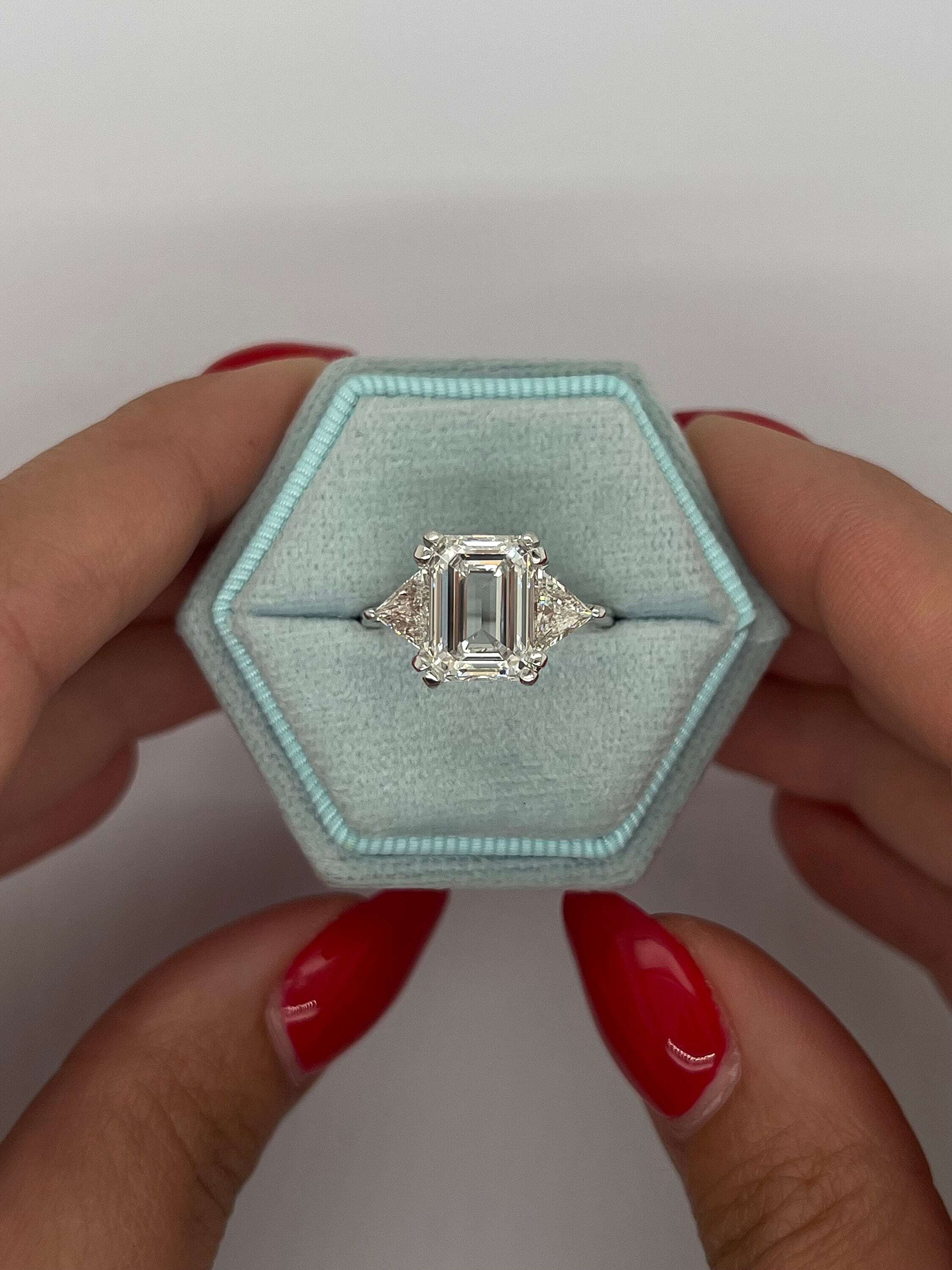 6 Carat Three Stone Emerald Cut Diamond Engagement Ring, Side Trillion Cut Diamonds