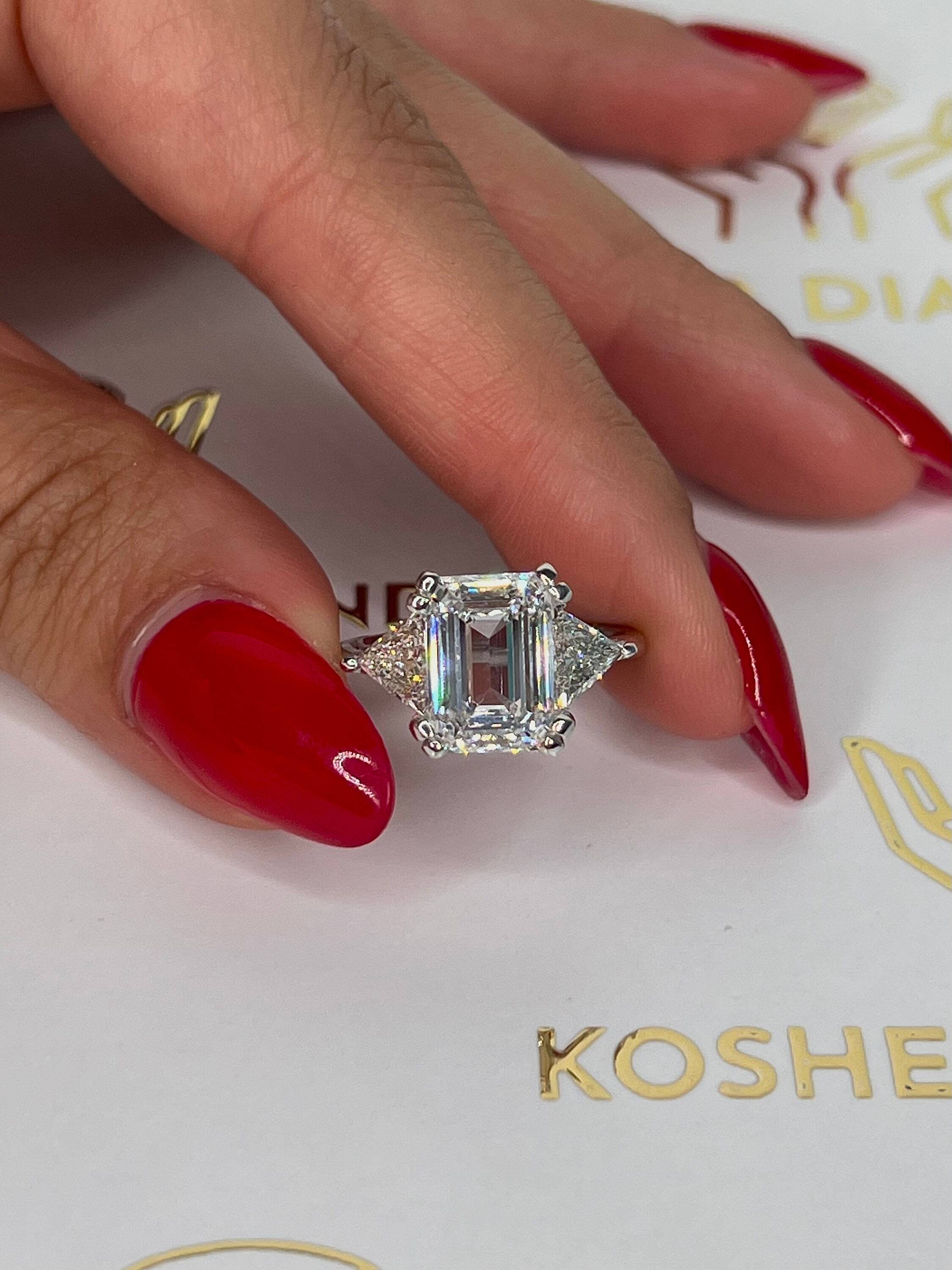 6 Carat Three Stone Emerald Cut Diamond Engagement Ring, Side Trillion Cut Diamonds