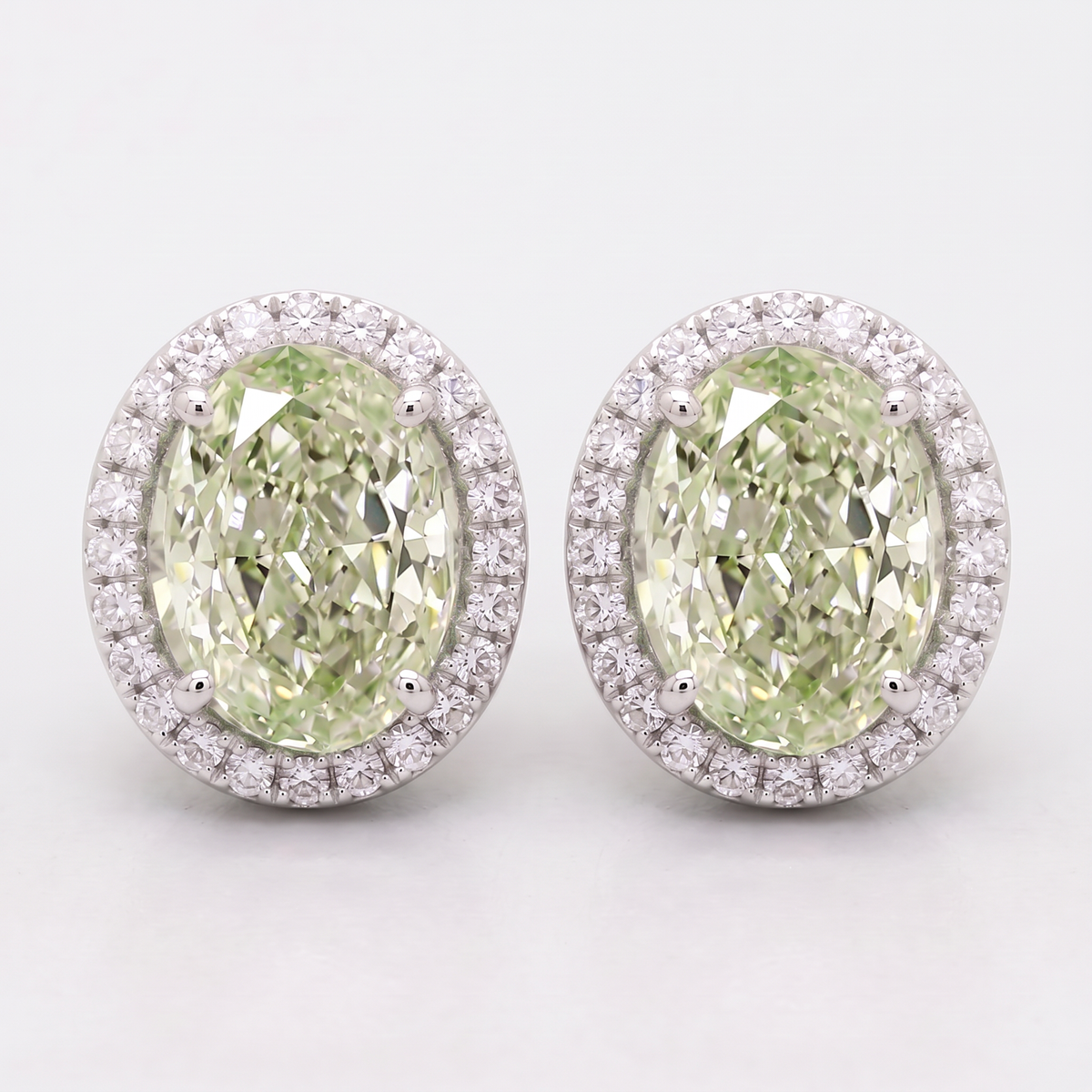 4.30 Carat Total Fancy Green Oval Diamond Halo Earrings