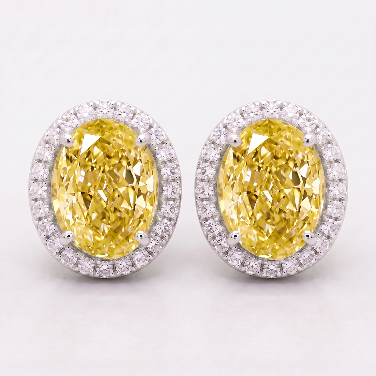 4.30 Carat Total Vivid Yellow Oval Diamond Halo Earrings